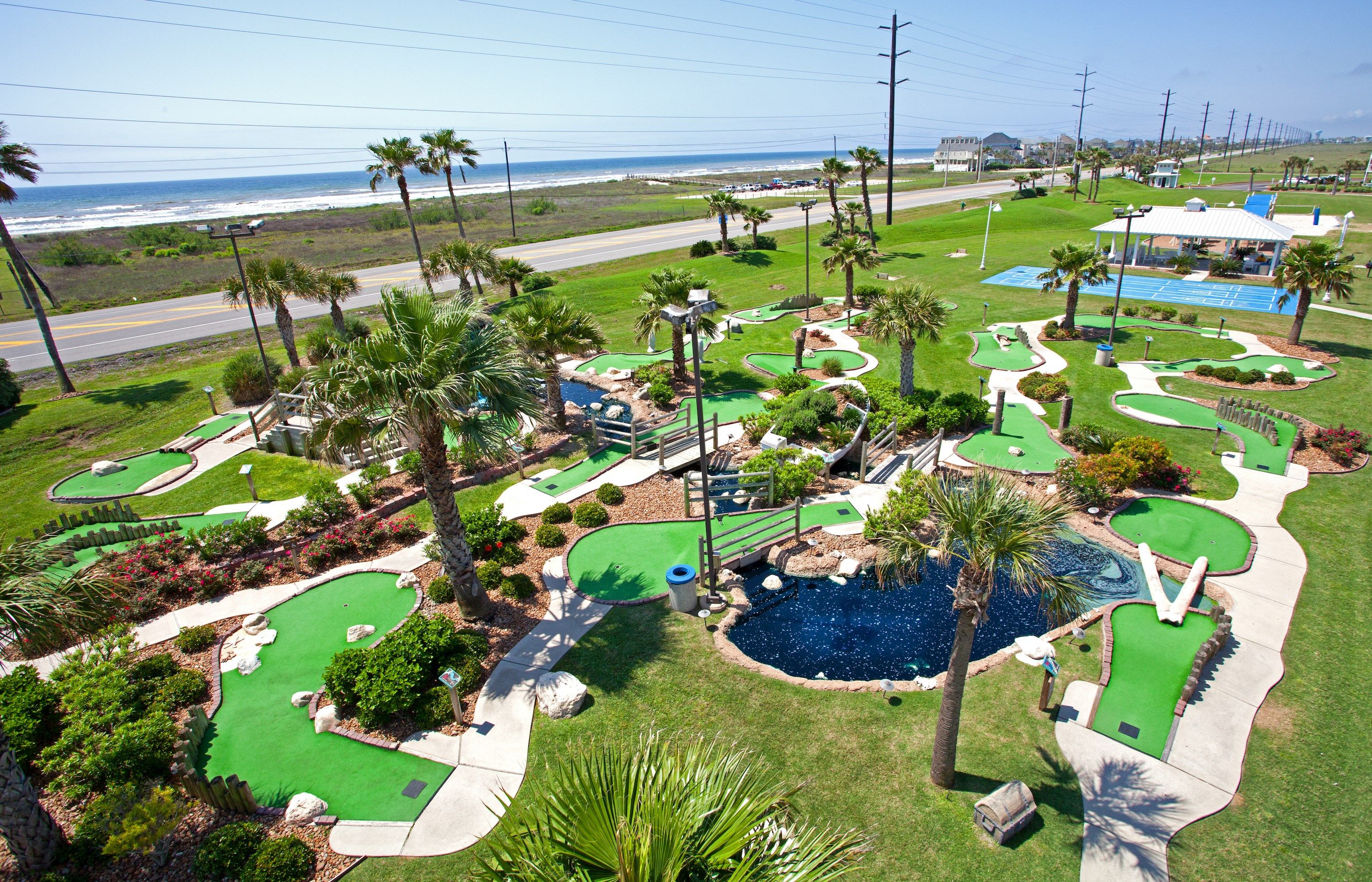 image Discover a vibrant mini-golf oasis surrounded by nature and fun.