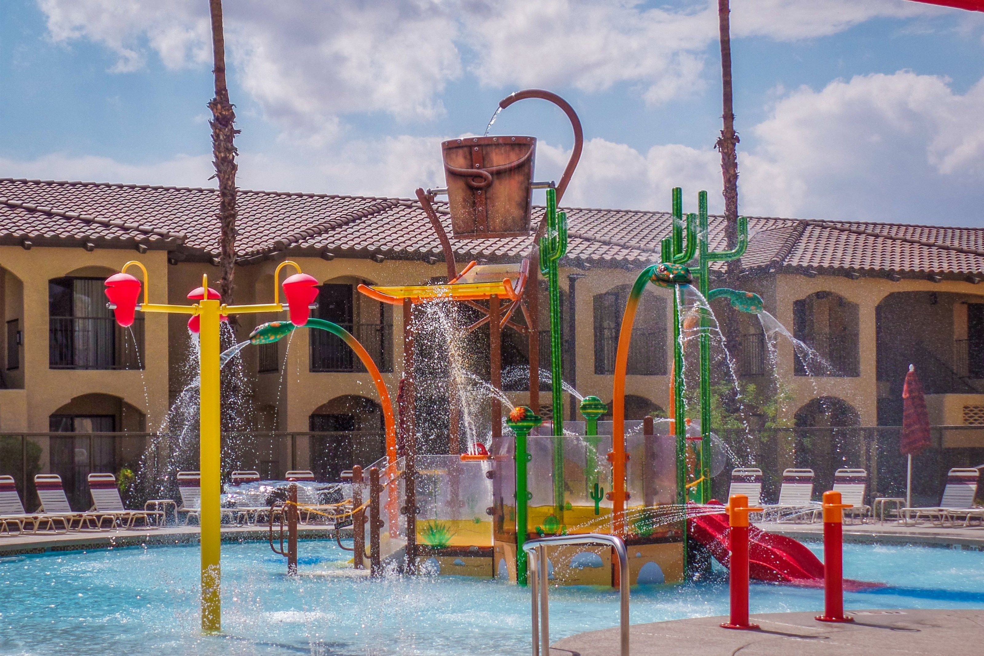 image Dive into fun at the Splash Canyon water feature, where vibrant slides and playful splashes await.