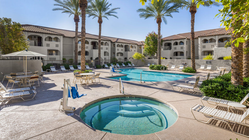 image Relax in the hot tub just steps away from the inviting pool area, perfect for unwinding!