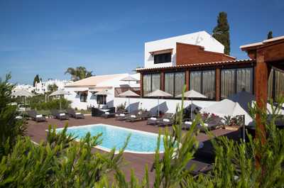Relax while lounging around the on-site outdoor pool.