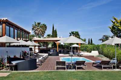 Lounge by the pool in the sunshine.