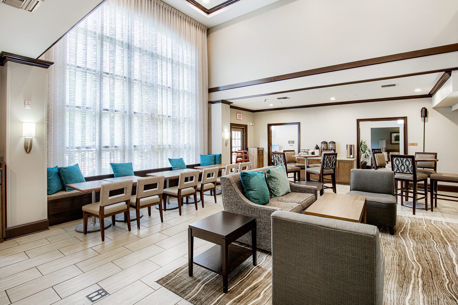 image Lobby lounge with sofa seating and floor-to-ceiling windows