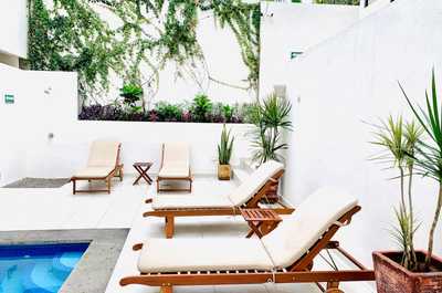 Outdoor shower and lounge chairs available.
