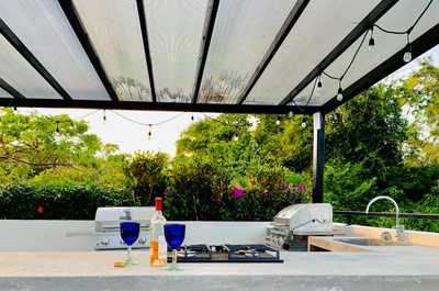Shared rooftop kitchen offers covered spaces as well!