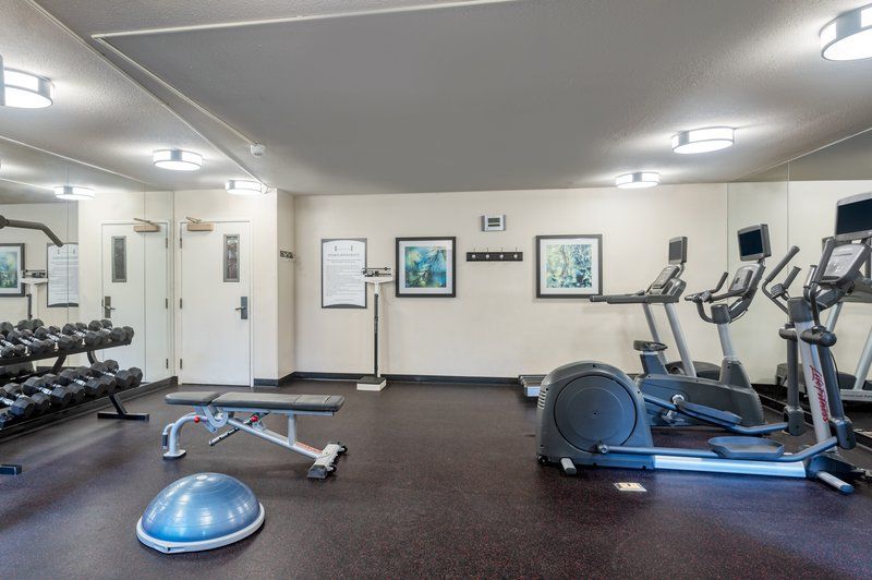 image Elliptical and cardio machines in the 24-hour fitness center, with free weights available