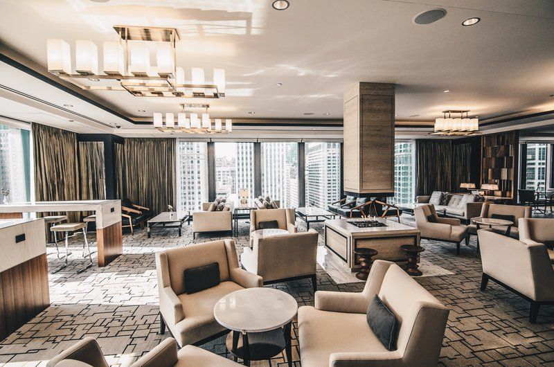 image Dining tables arranged in the social area — complimentary appetizers and drinks Mon–Wed evenings