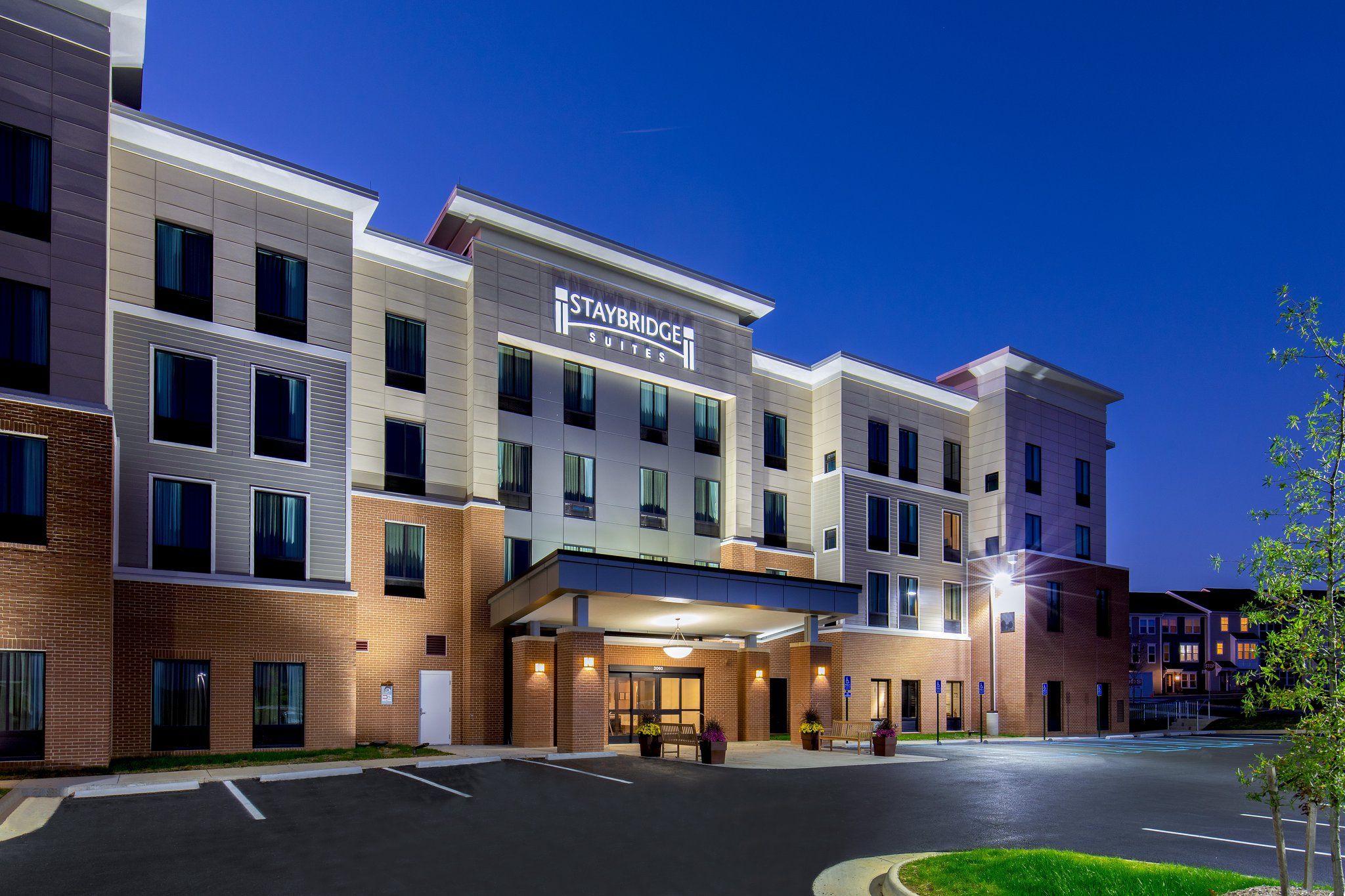 image Modern exterior building facade with ample parking.