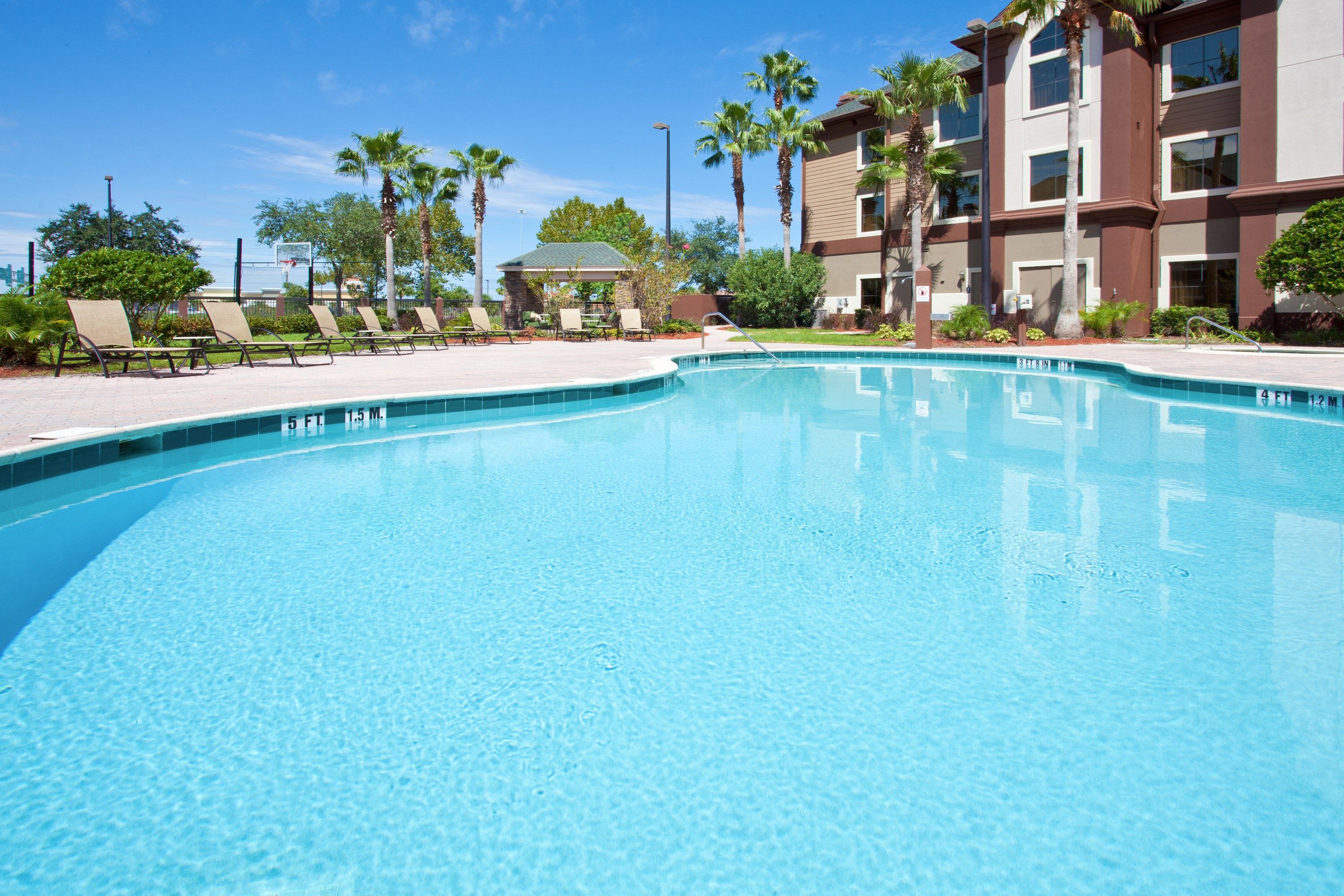 image Dive into the lovely outdoor pool on a hot day.