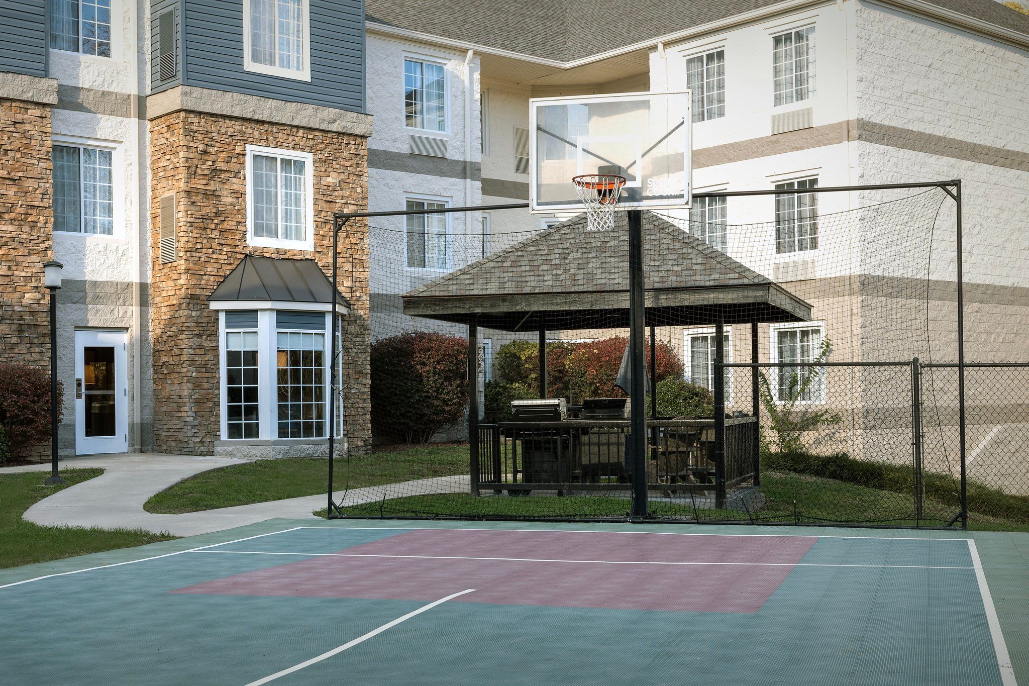 image Shoot some hoops or unwind in the gazebo overlooking the basketball court, perfect for sunny afternoons.