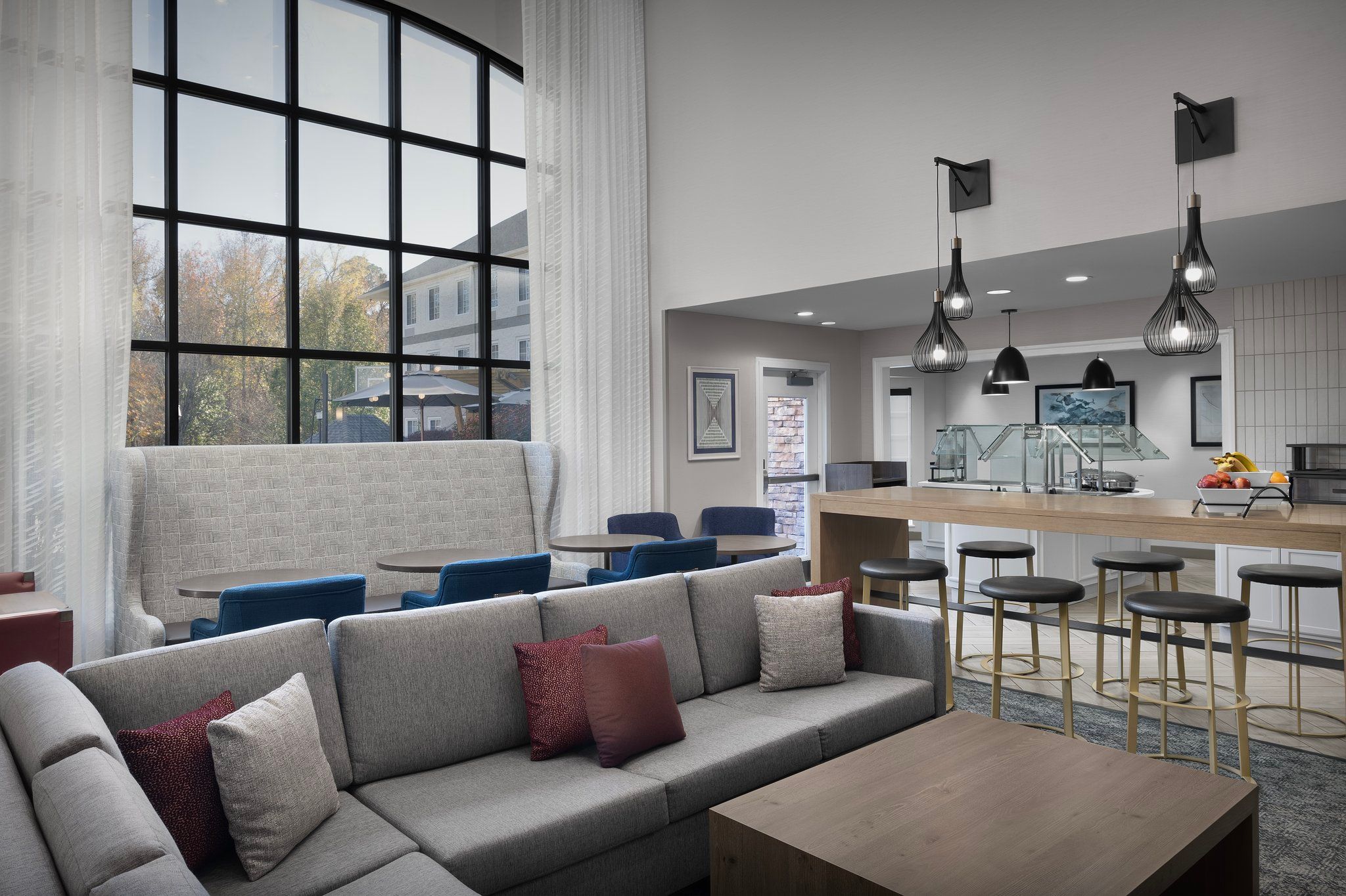 image Relax and unwind in the plush seating, surrounded by natural light and stylish decor.
