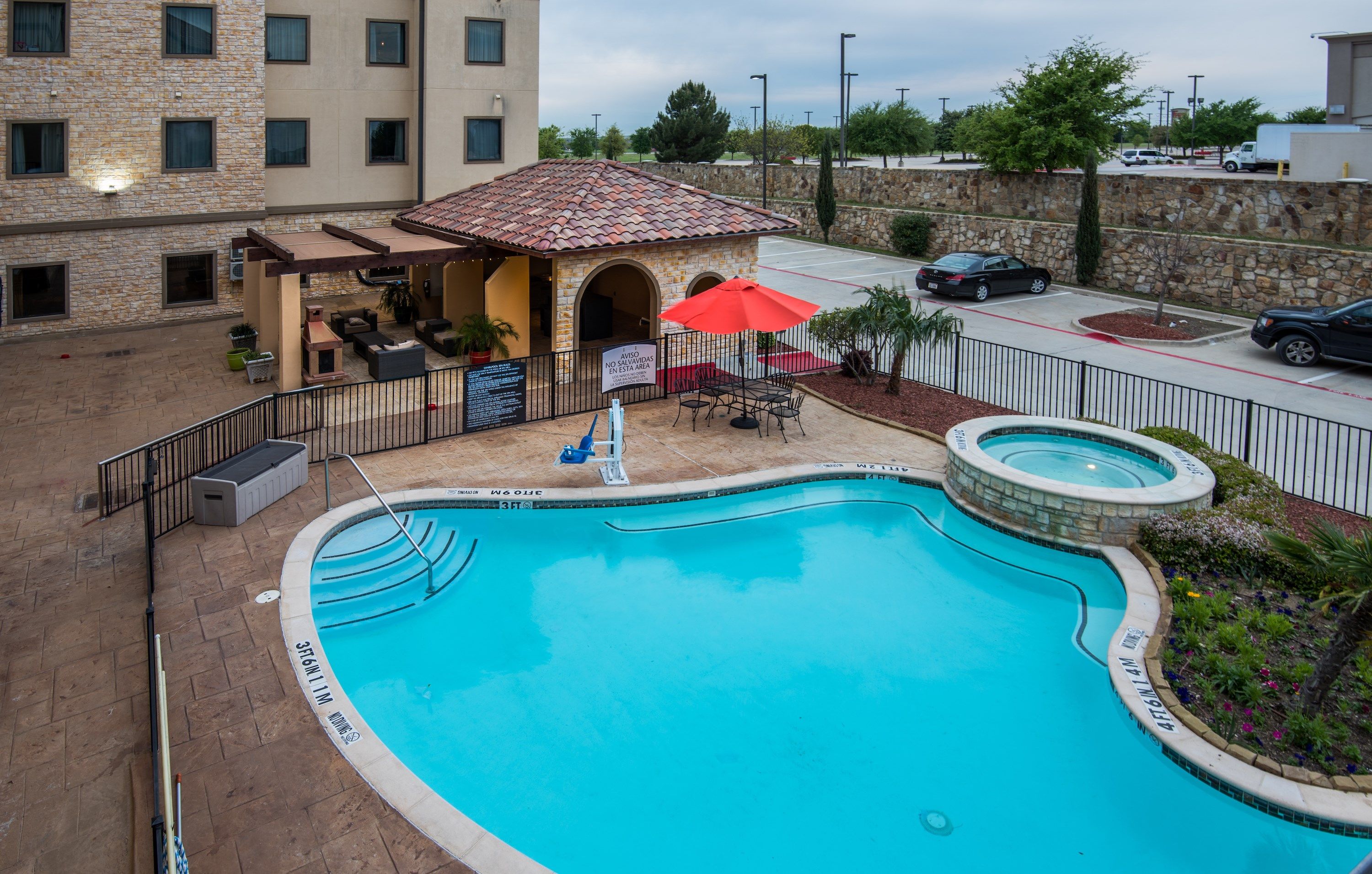 image Dive into the lovely outdoor pool during the summer.