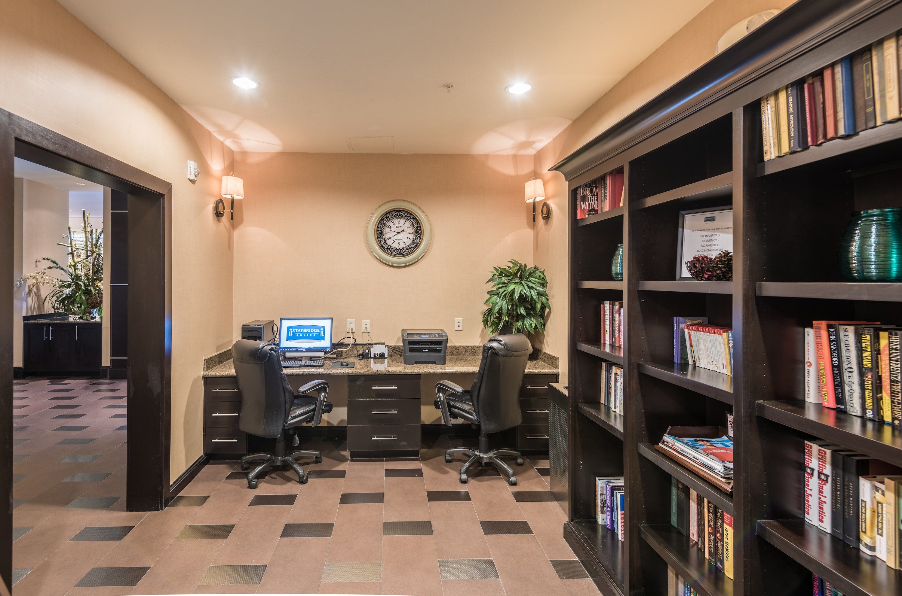 image Business center with workstations and bookshelves.