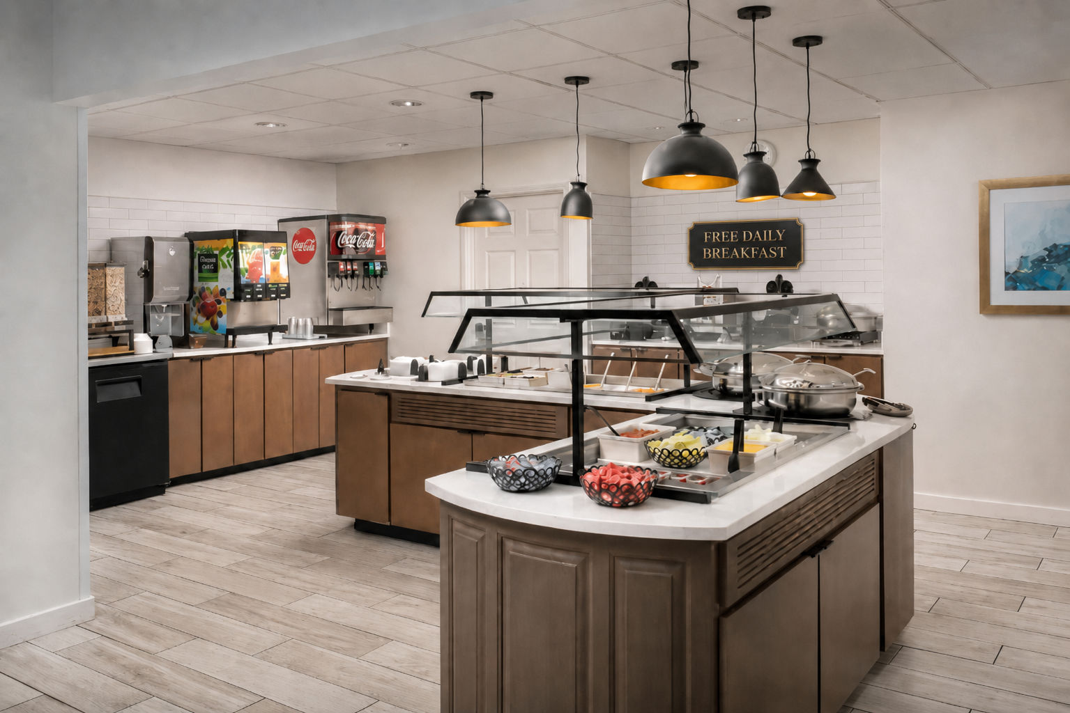 image Curved breakfast counter with fresh fruit, hot options, and beverages under black pendant lights