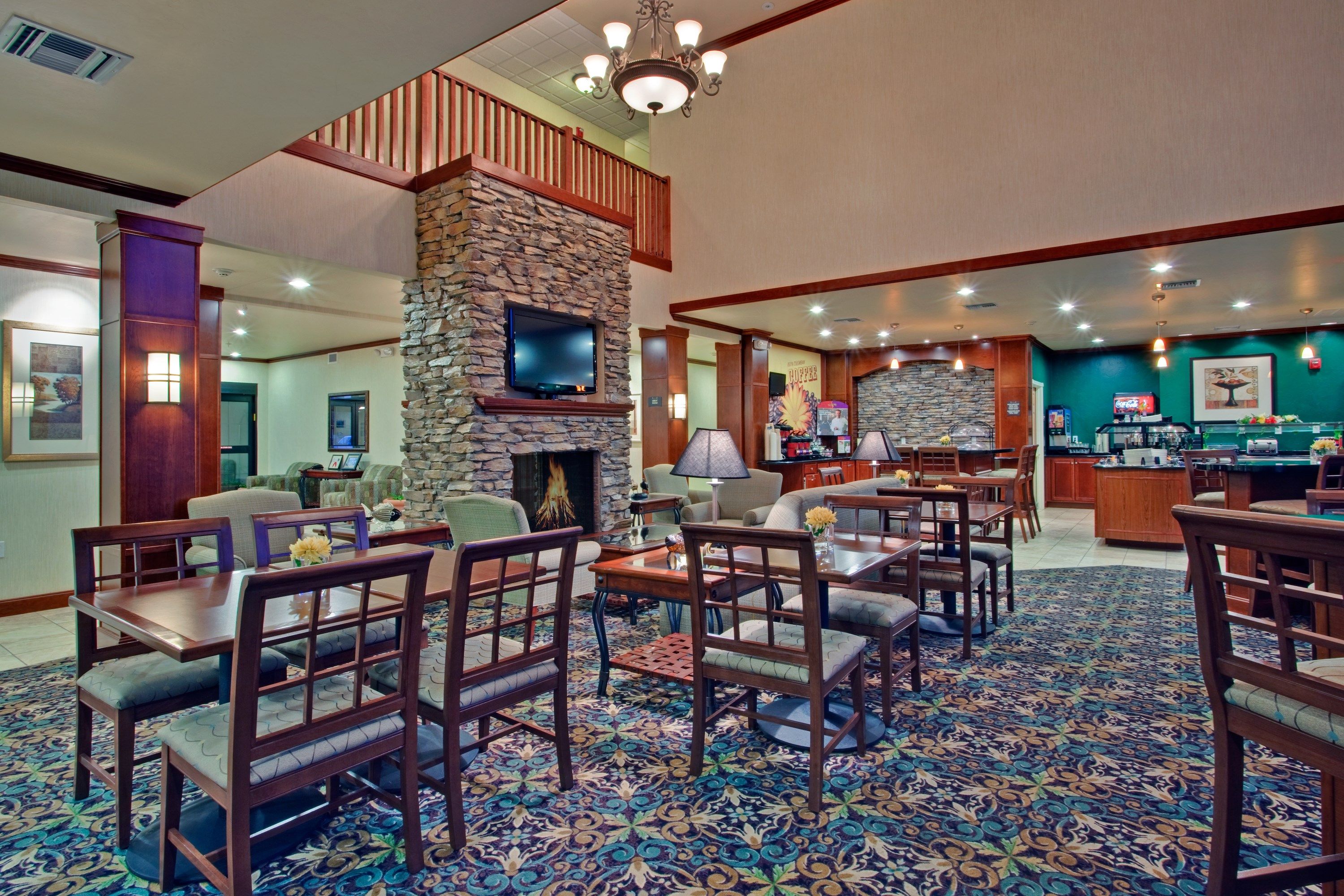 image Spacious guest lounge with fireplace and comfortable seating.
