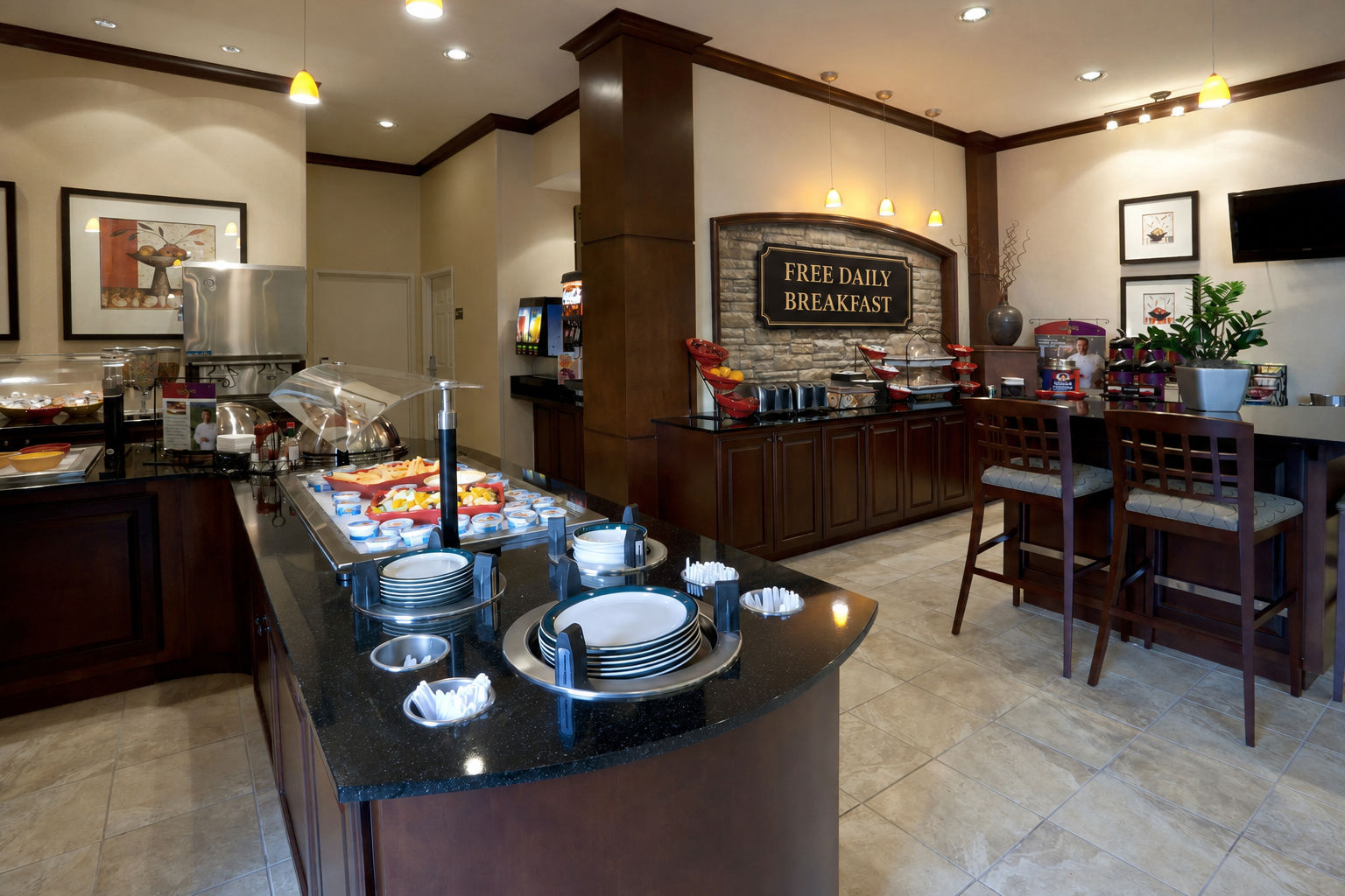 image Breakfast buffet with hot stations and open dining seating — included in every stay