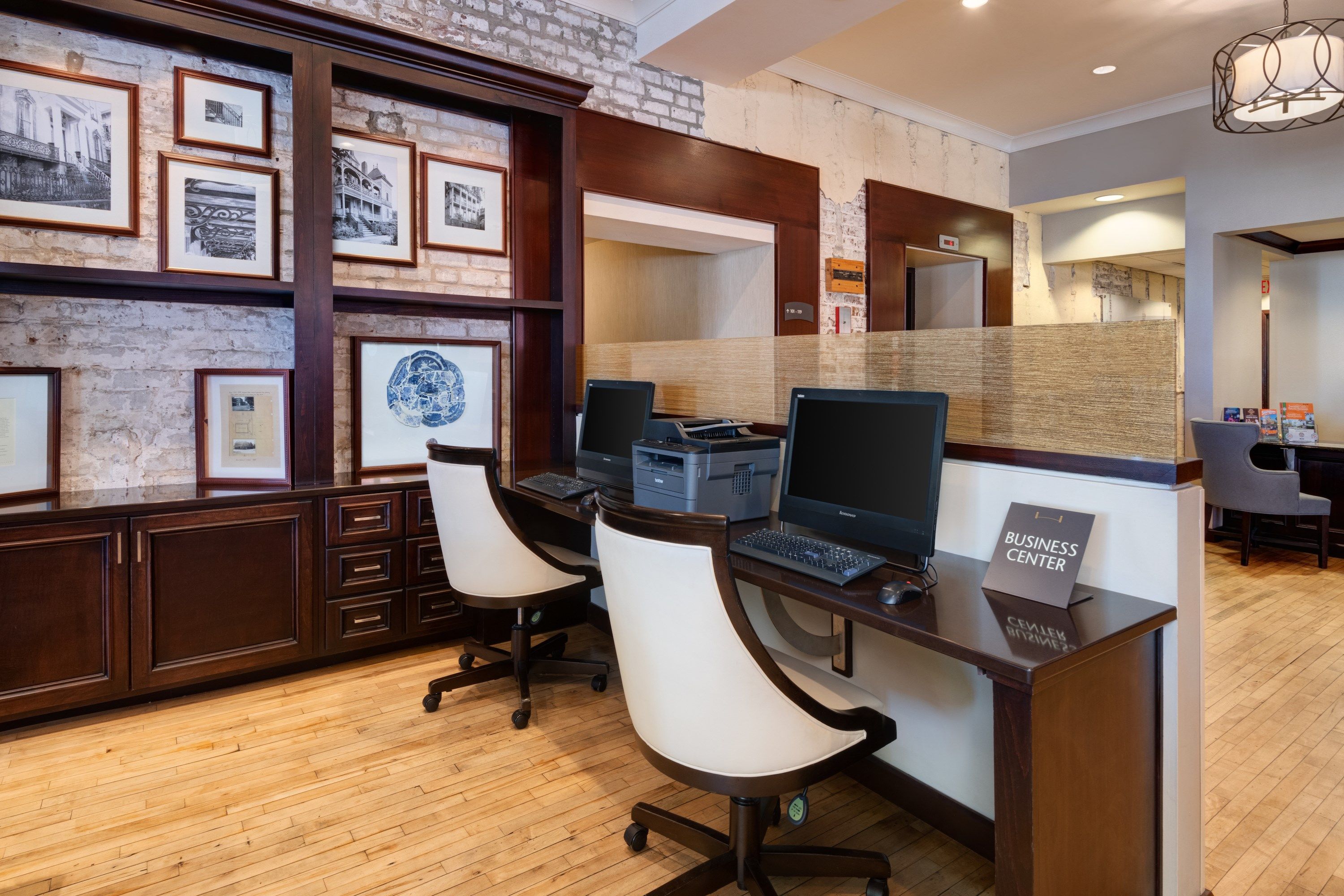 image A fully equipped business center with computers, monitors, and workstations.