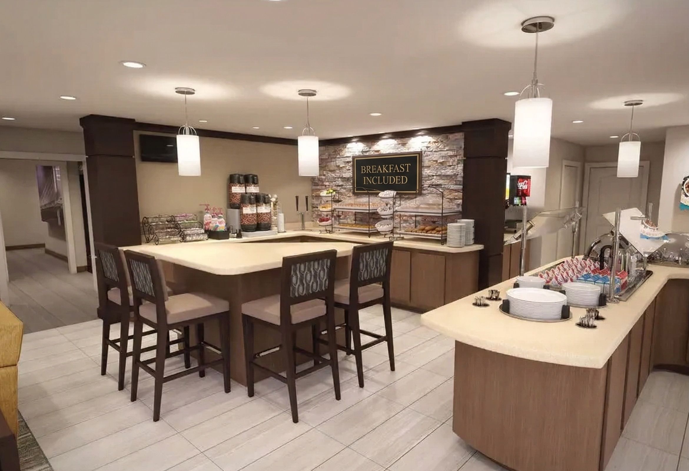 image The inviting dining area offers a stylish space for guests to enjoy complimentary breakfast and refreshments.