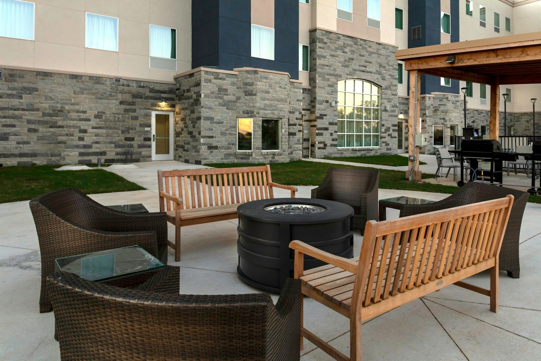 image Gather around the fire pit, perfect for cozy evenings with friends.