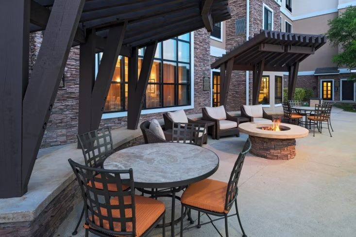 image Gather around the on-site outdoor fire pit and courtyard seating area.