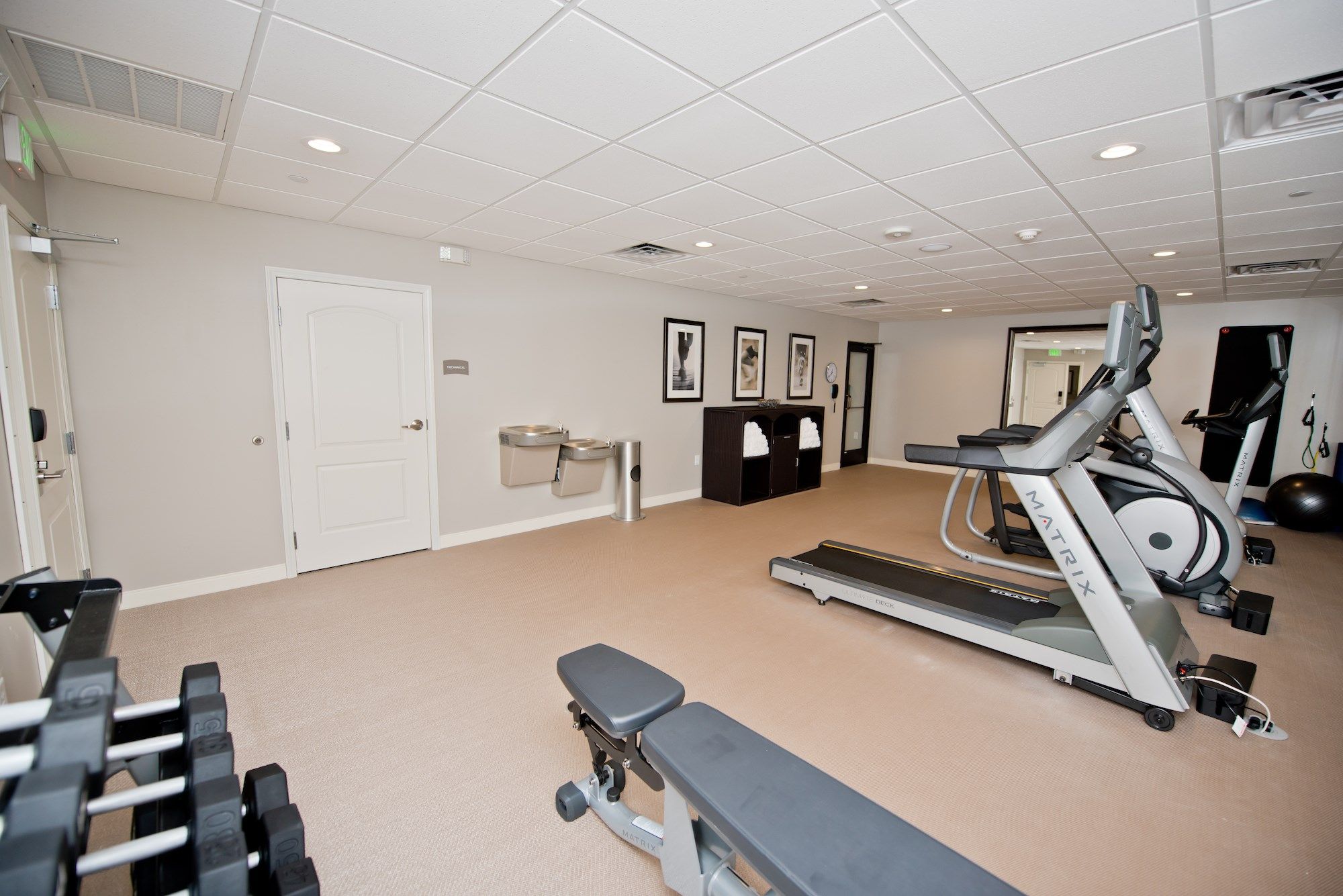 image Cardio machines and free weights fill the 24/7 fitness center — open whenever your schedule calls for it