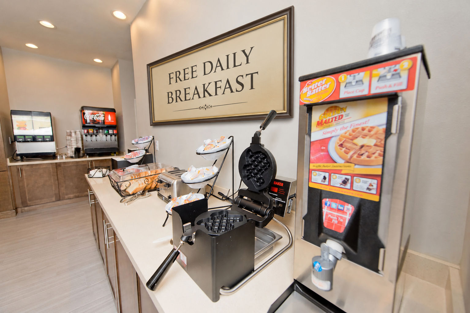 image Start your day with waffles, pastries, and hot beverages at the complimentary breakfast spread