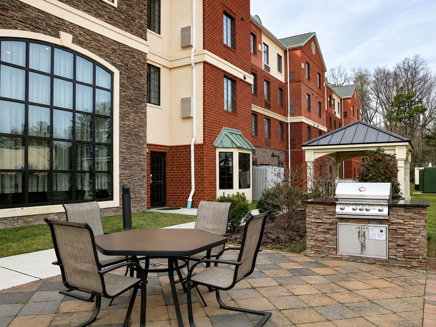 image Relax outside with seating and a grill.