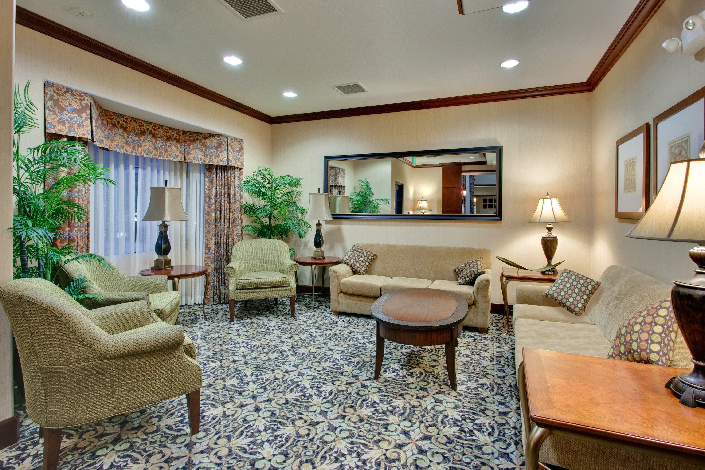 image Cozy lounge area with comfortable seating and decorative plants.