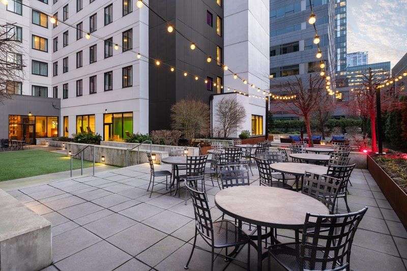 image Outdoor courtyard with city views and patio seating