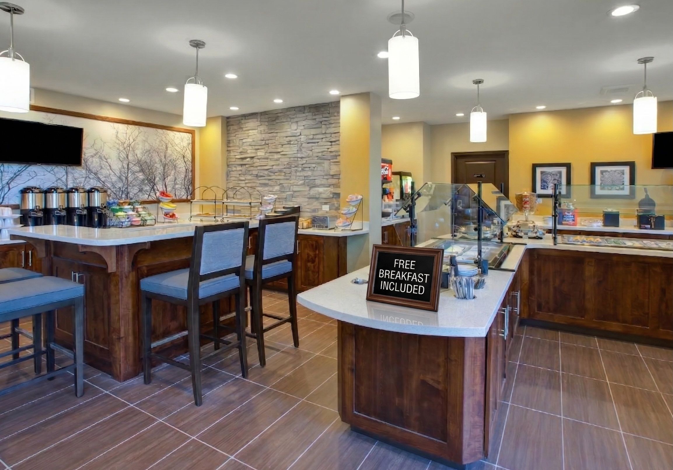 image omplimentary breakfast area with hot and cold food selections.