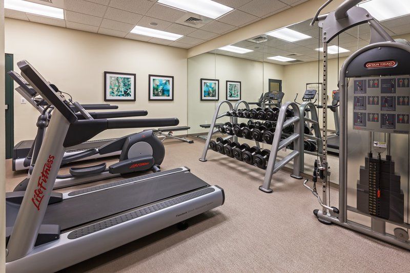 image Fitness center with treadmills, ellipticals, and free weights