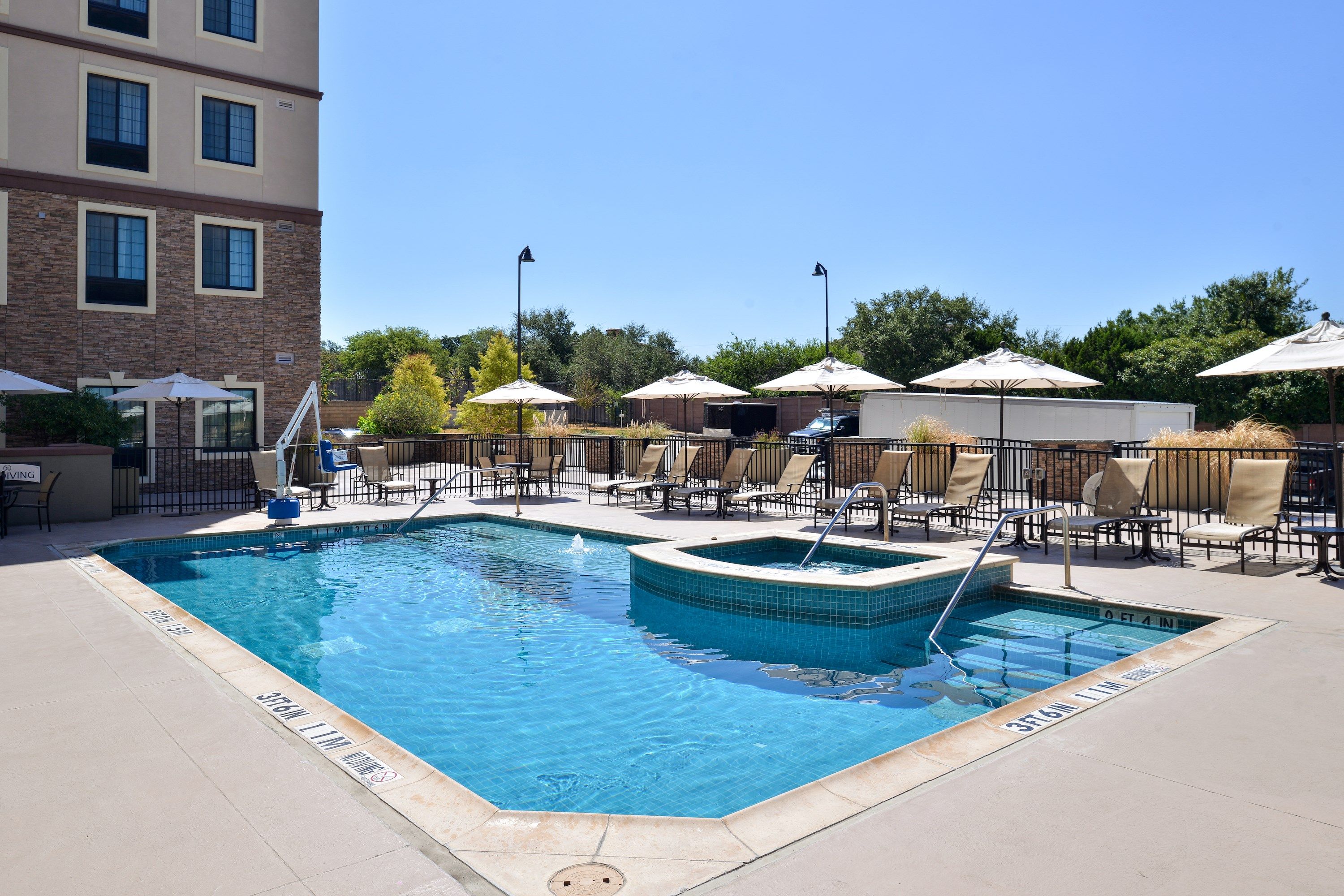 image Dive into the outdoor pool on a hot summer day.