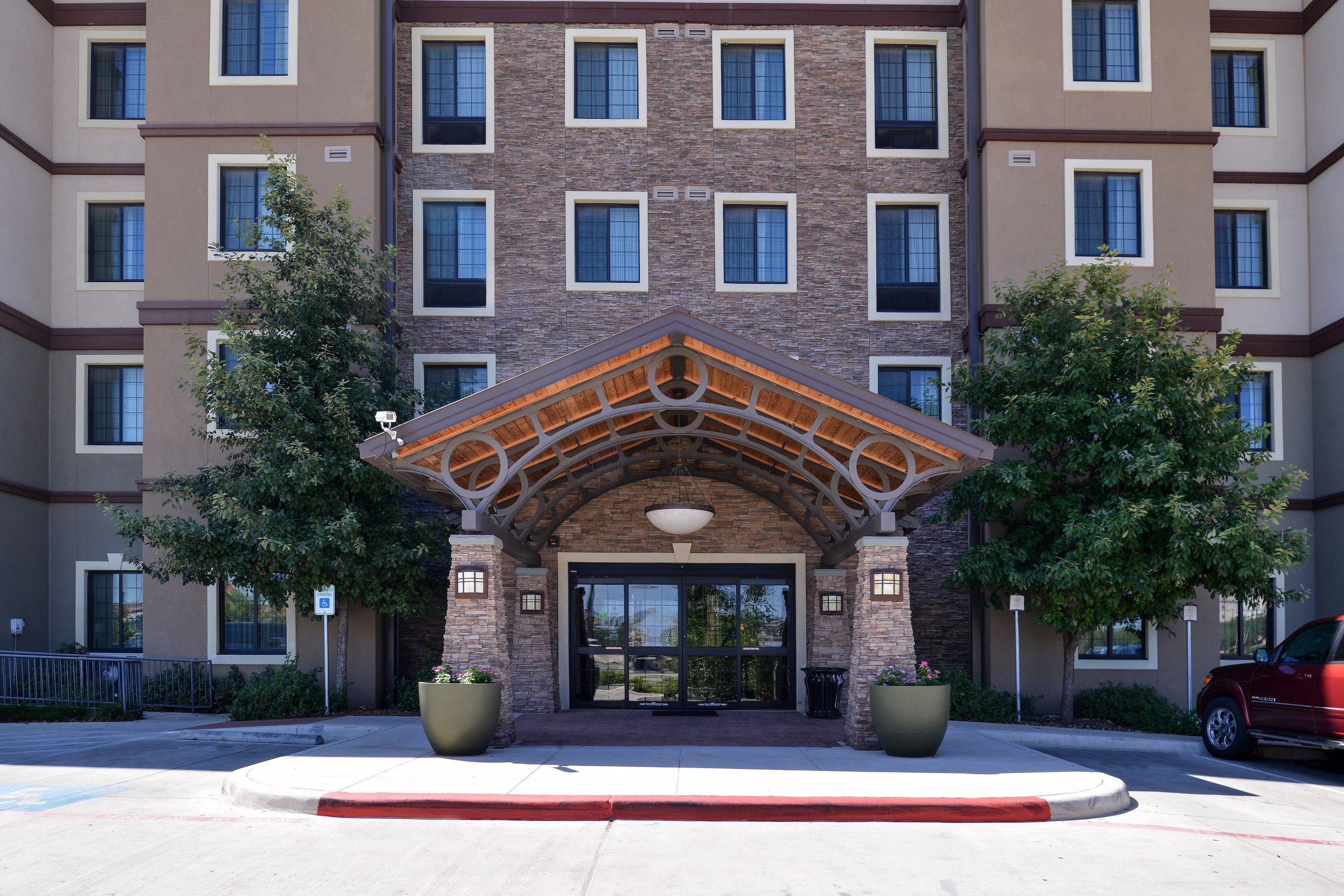 image Hotel exterior entrance with architectural stonework detail.