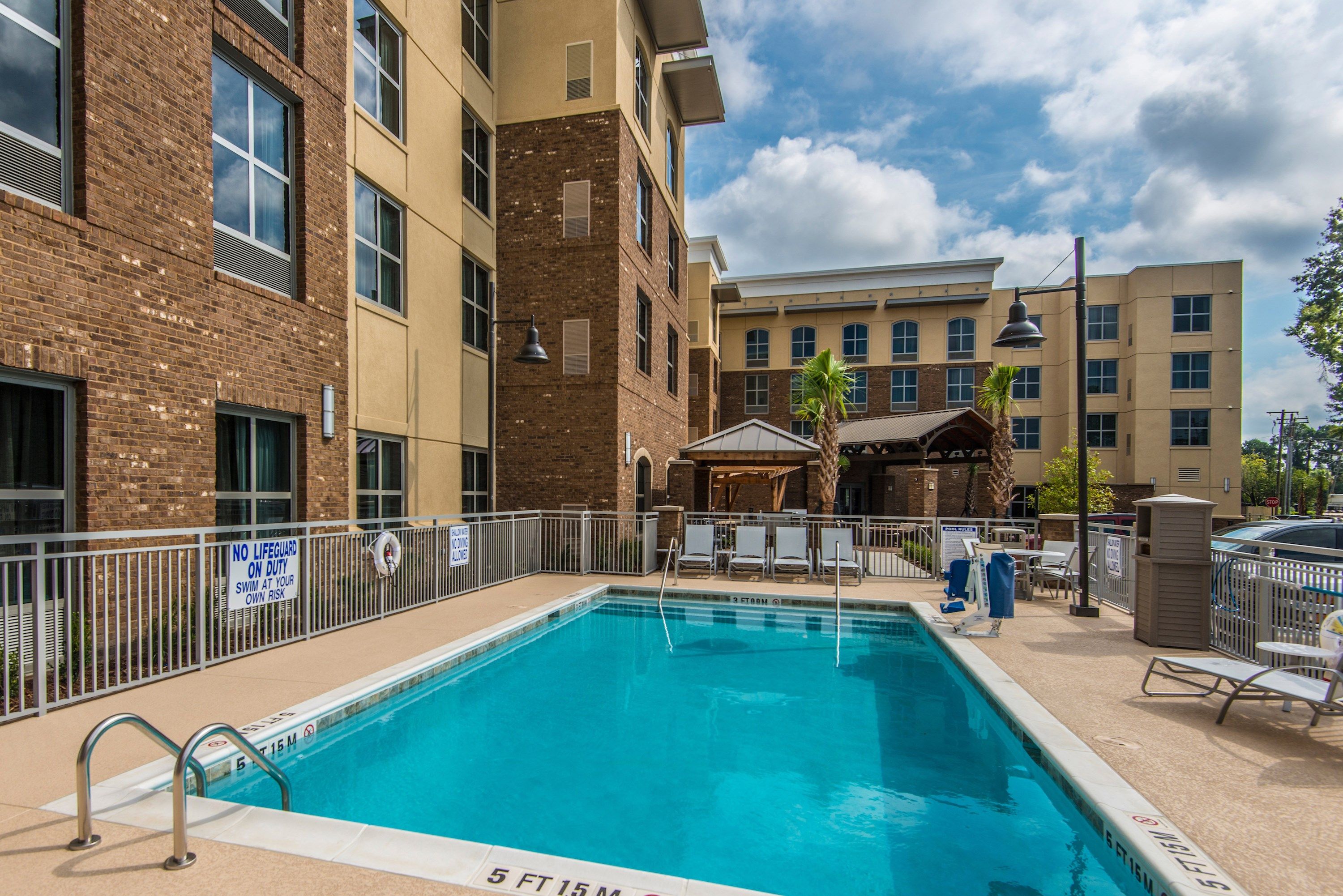 image Enjoy lounging around the on-site outdoor pool.