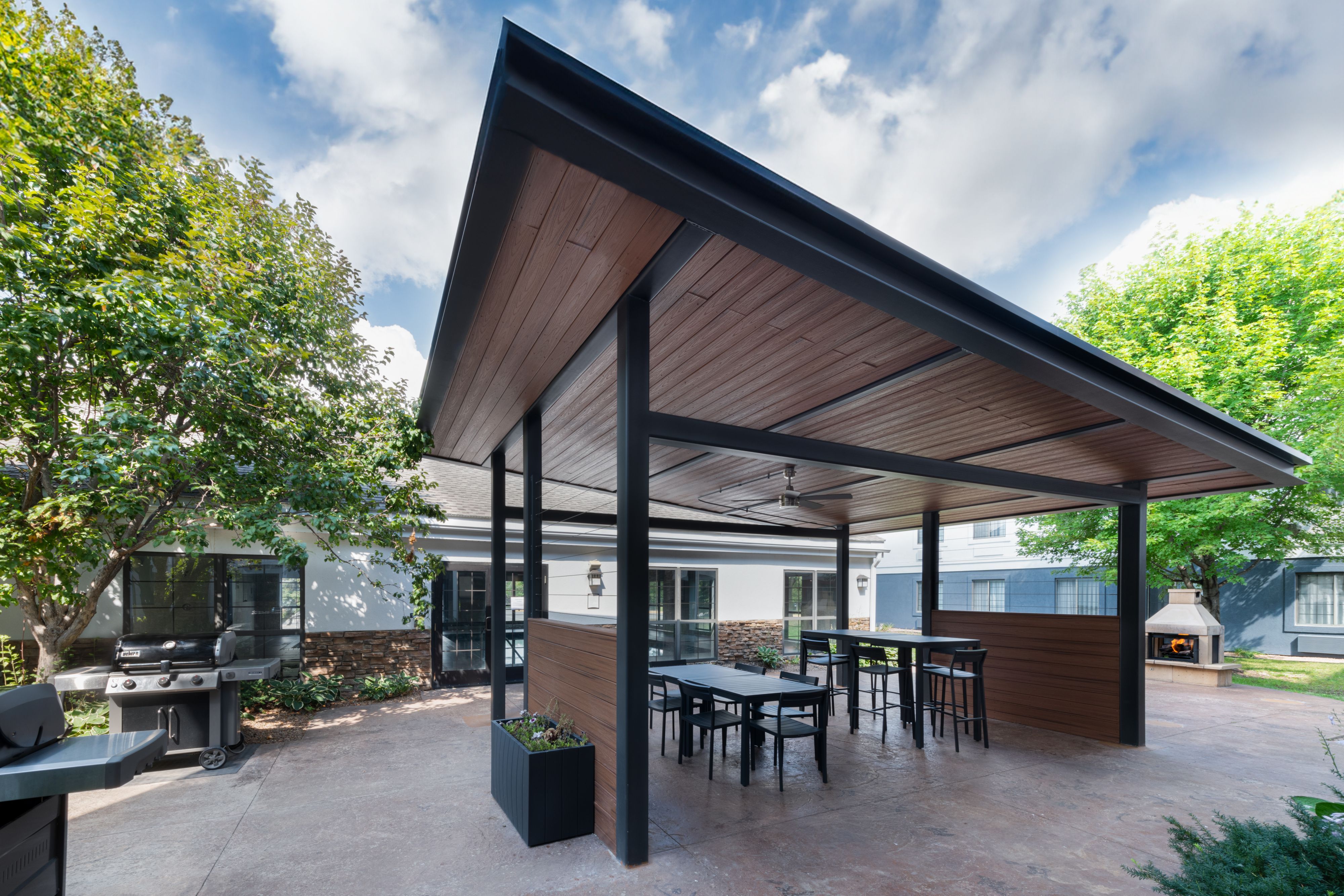 image Enjoy al fresco dining in the shaded outdoor pavilion, complete with barbecue facilities and seating.