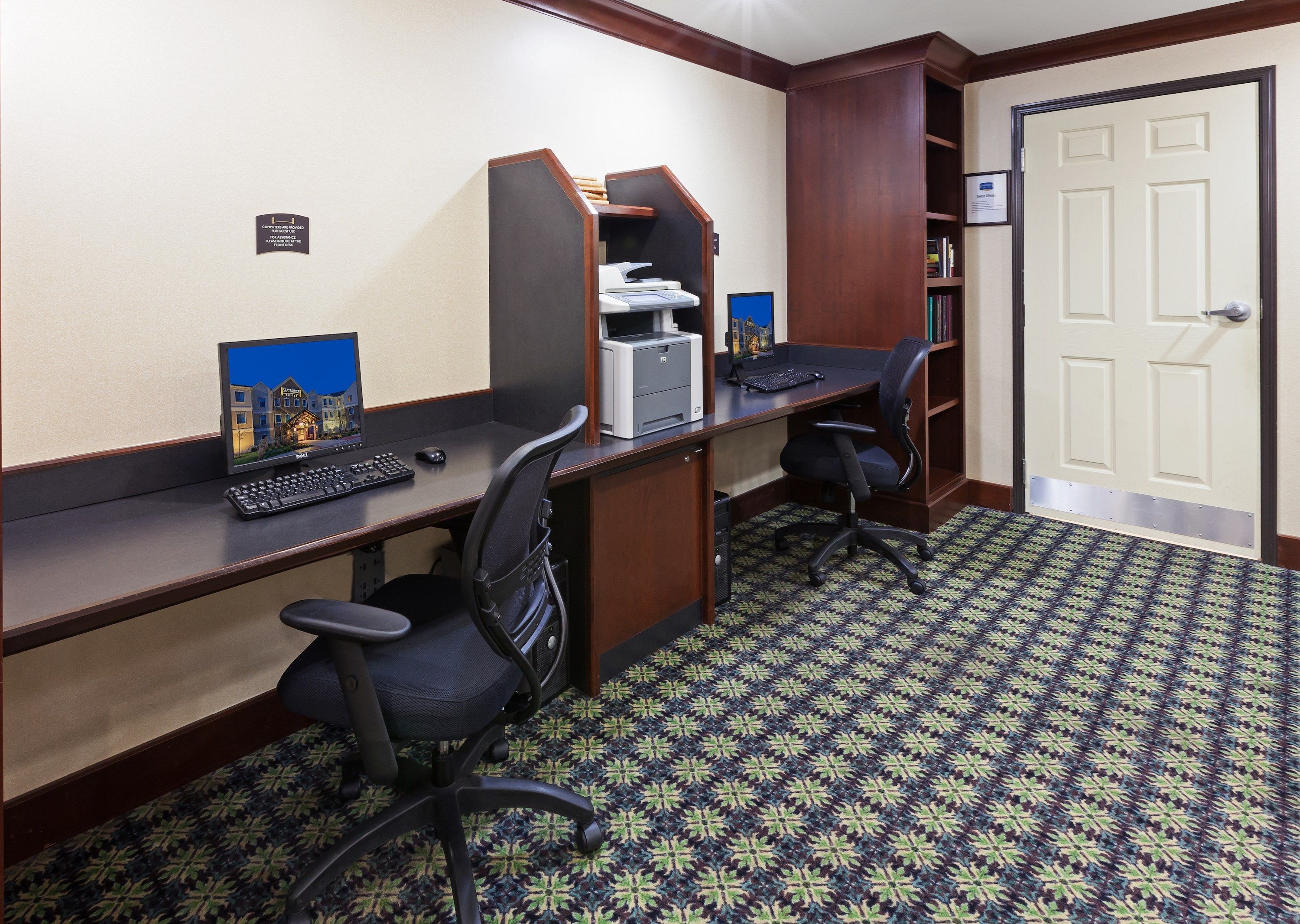 image Quiet business centre with two computers and a printer.