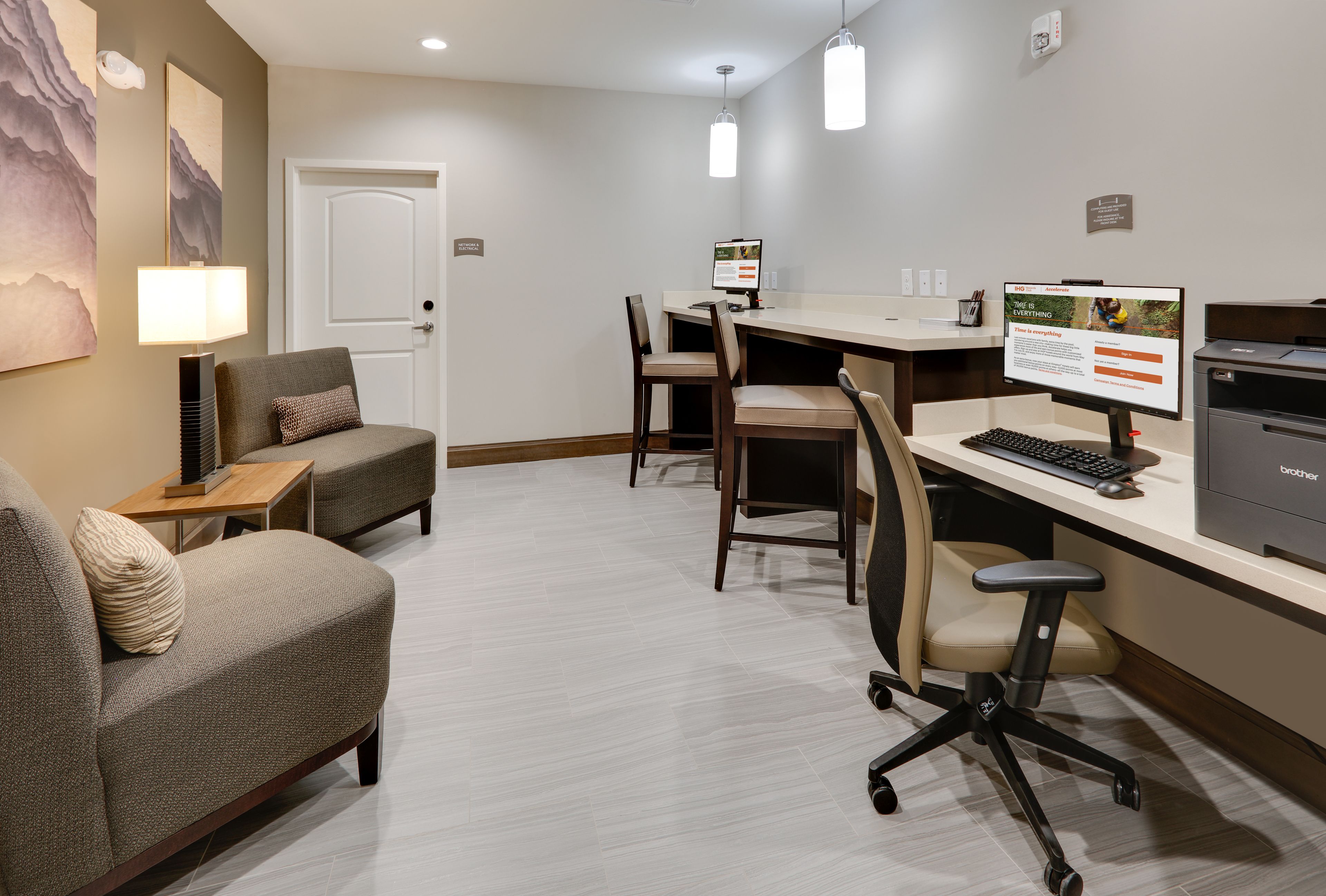 image On-site business center equipped for work, printing, and office needs.