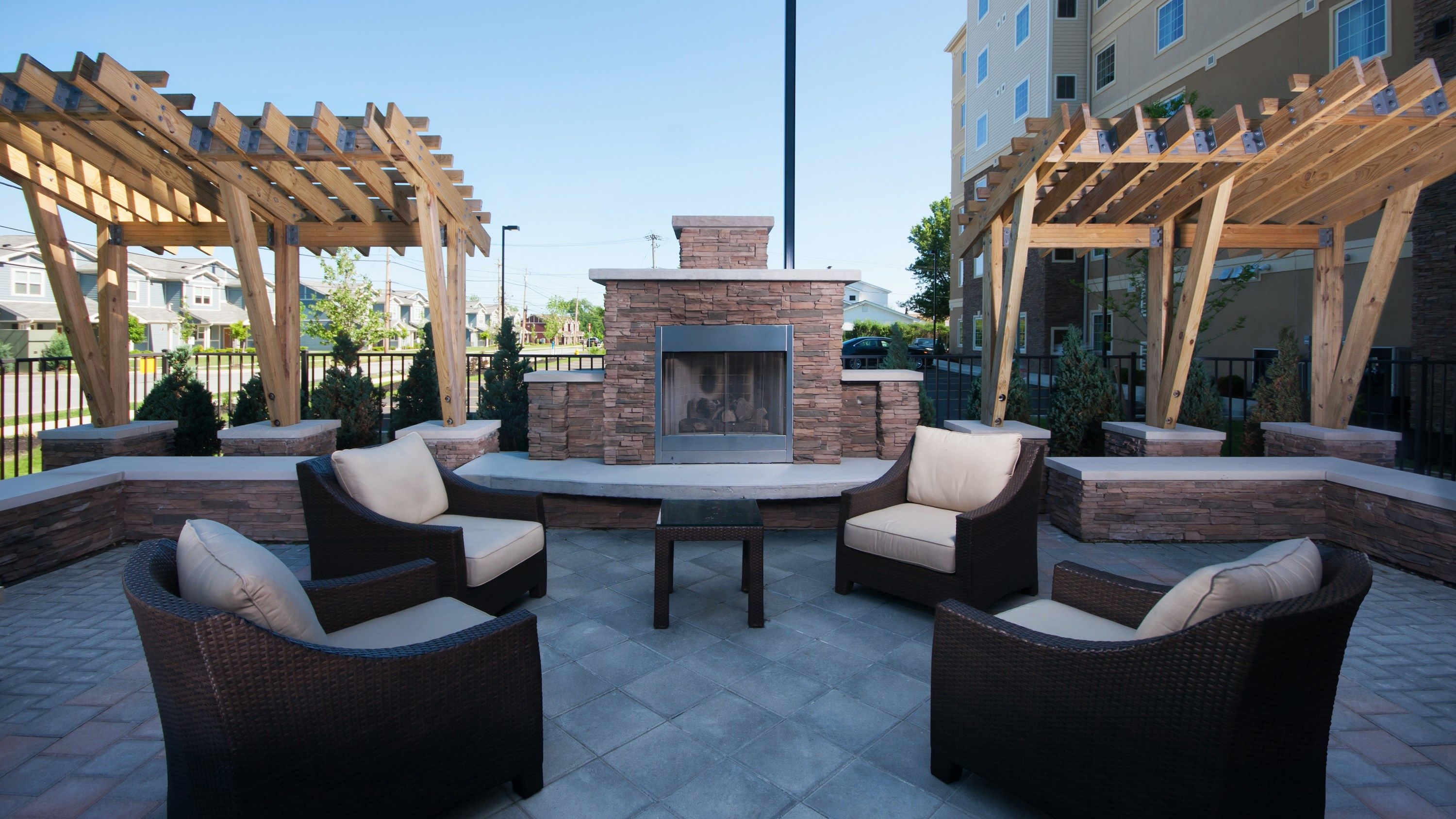 image Outdoor patio with stone fireplace and lounge seating