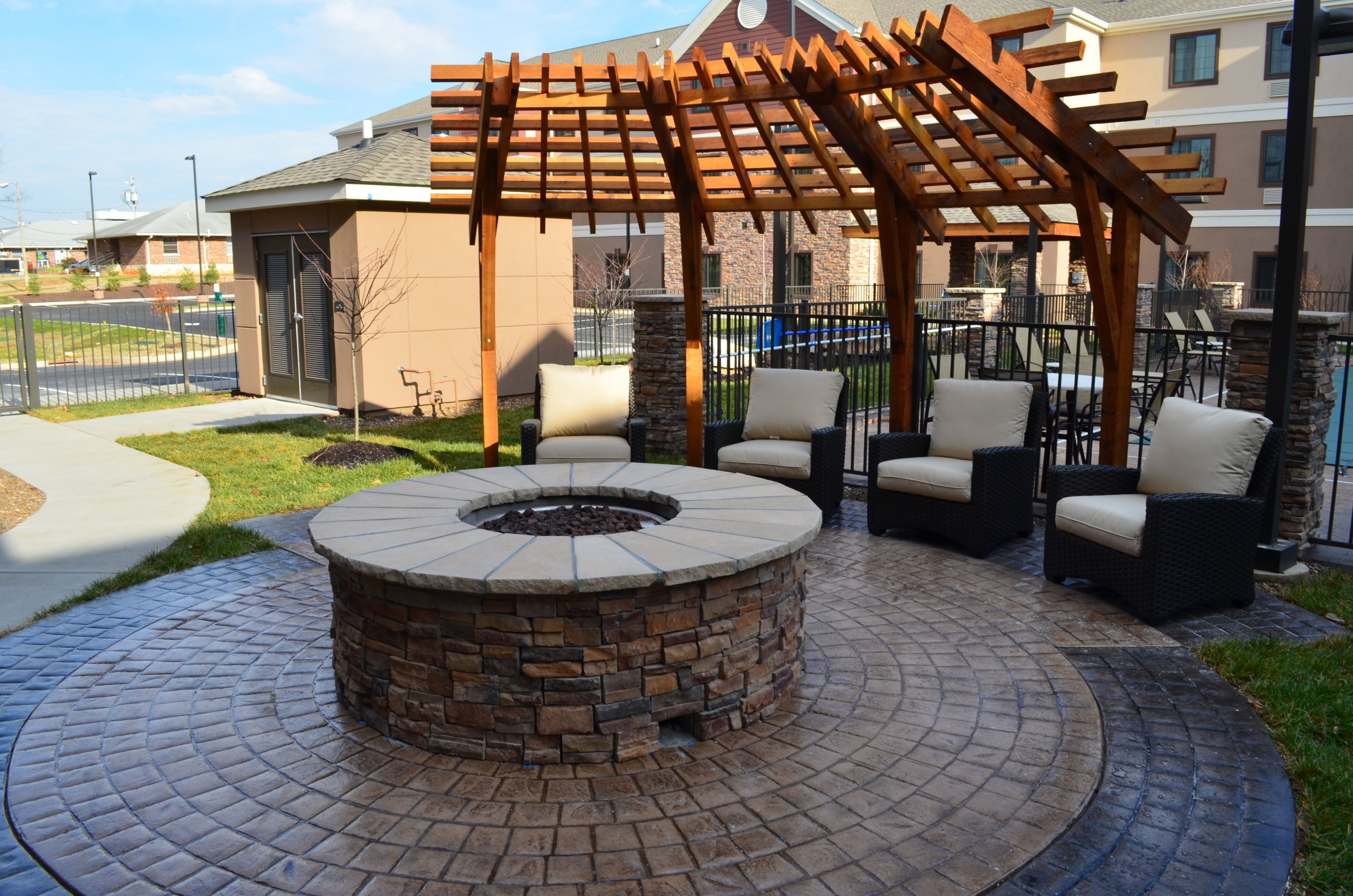 image Outdoor fire pit surrounded by comfortable lounge seating.