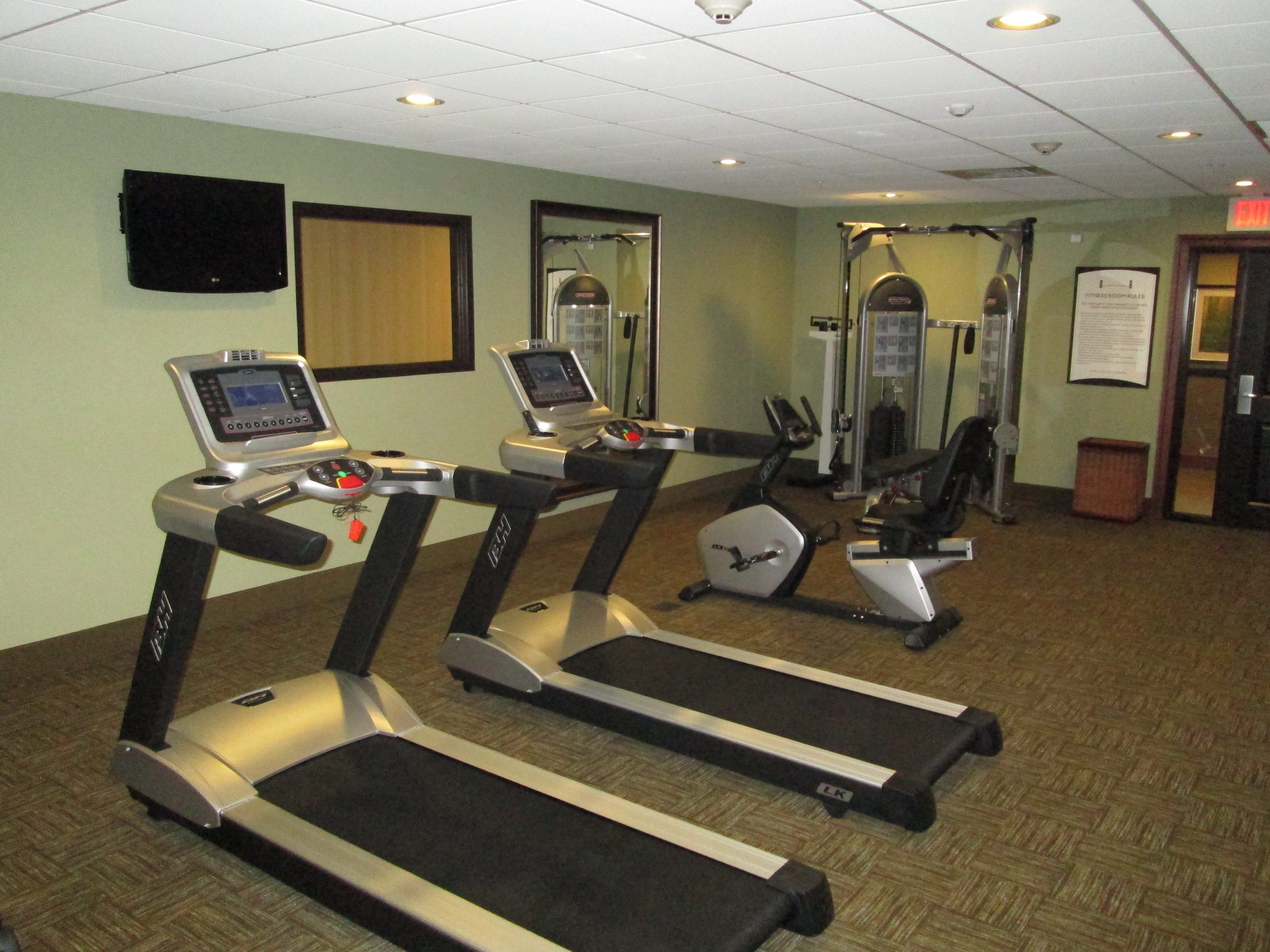 image Fitness center with treadmills and exercise equipment.