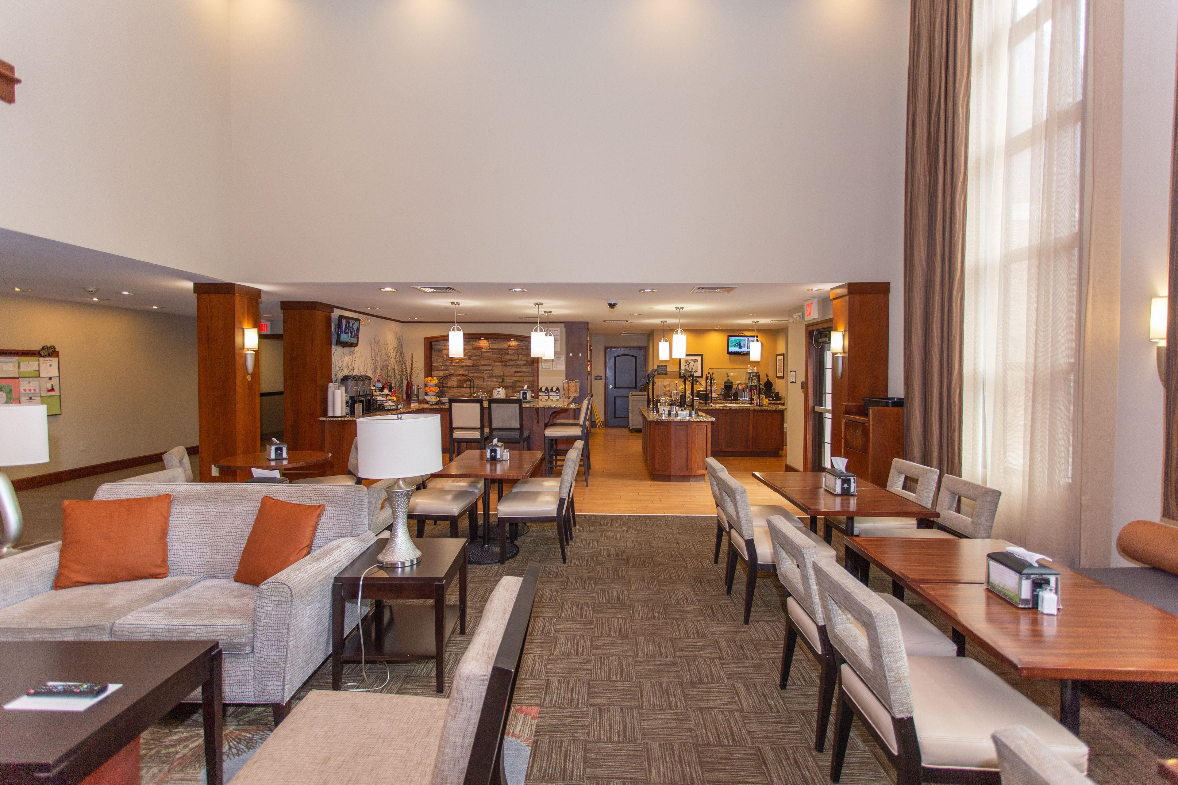 image Inviting dining space with a well-stocked complimentary breakfast area.