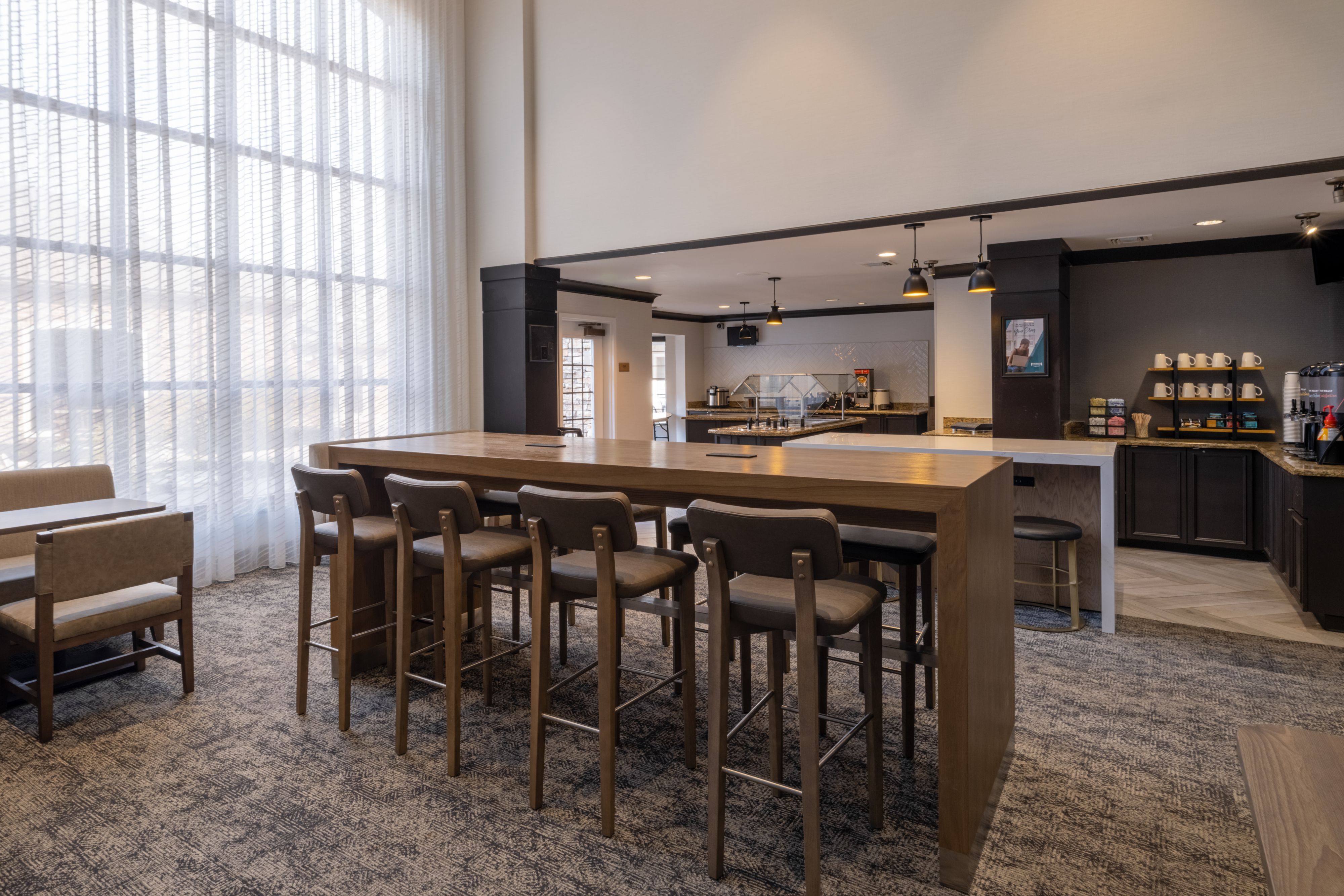 image Bright breakfast dining room with ample seating for guests.