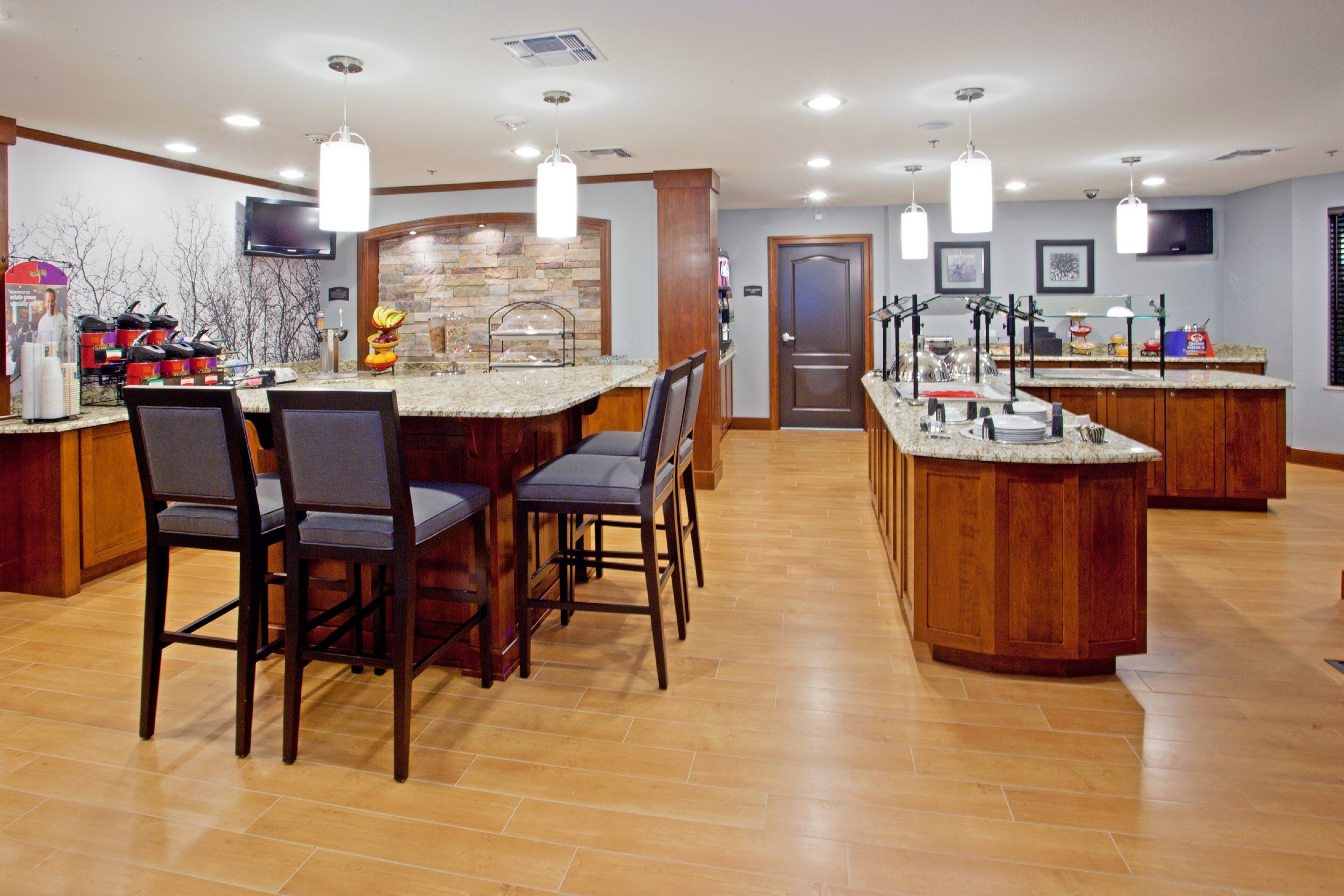 image Breakfast service area with seating and food display.