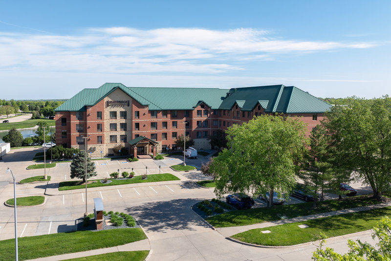 image Aerial view of building with green roof.