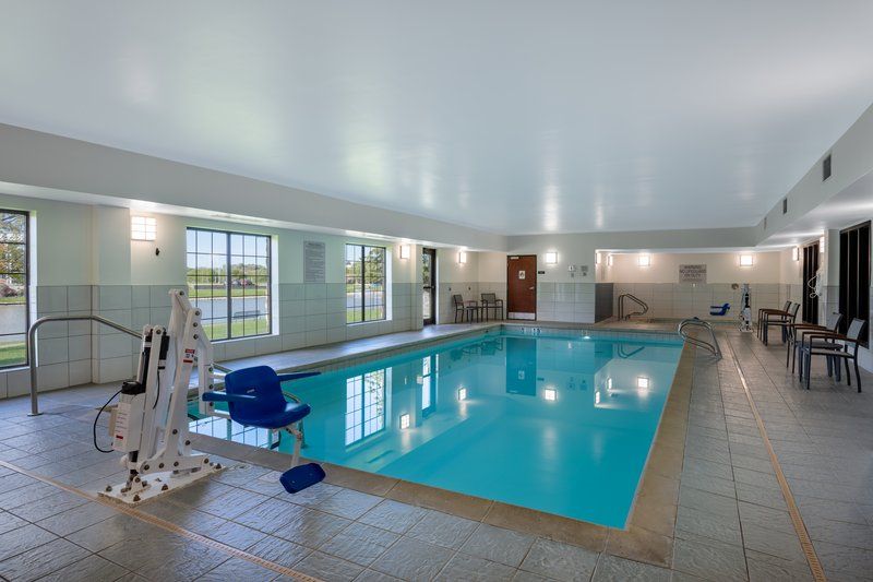 image Indoor swimming pool with accessible seating.