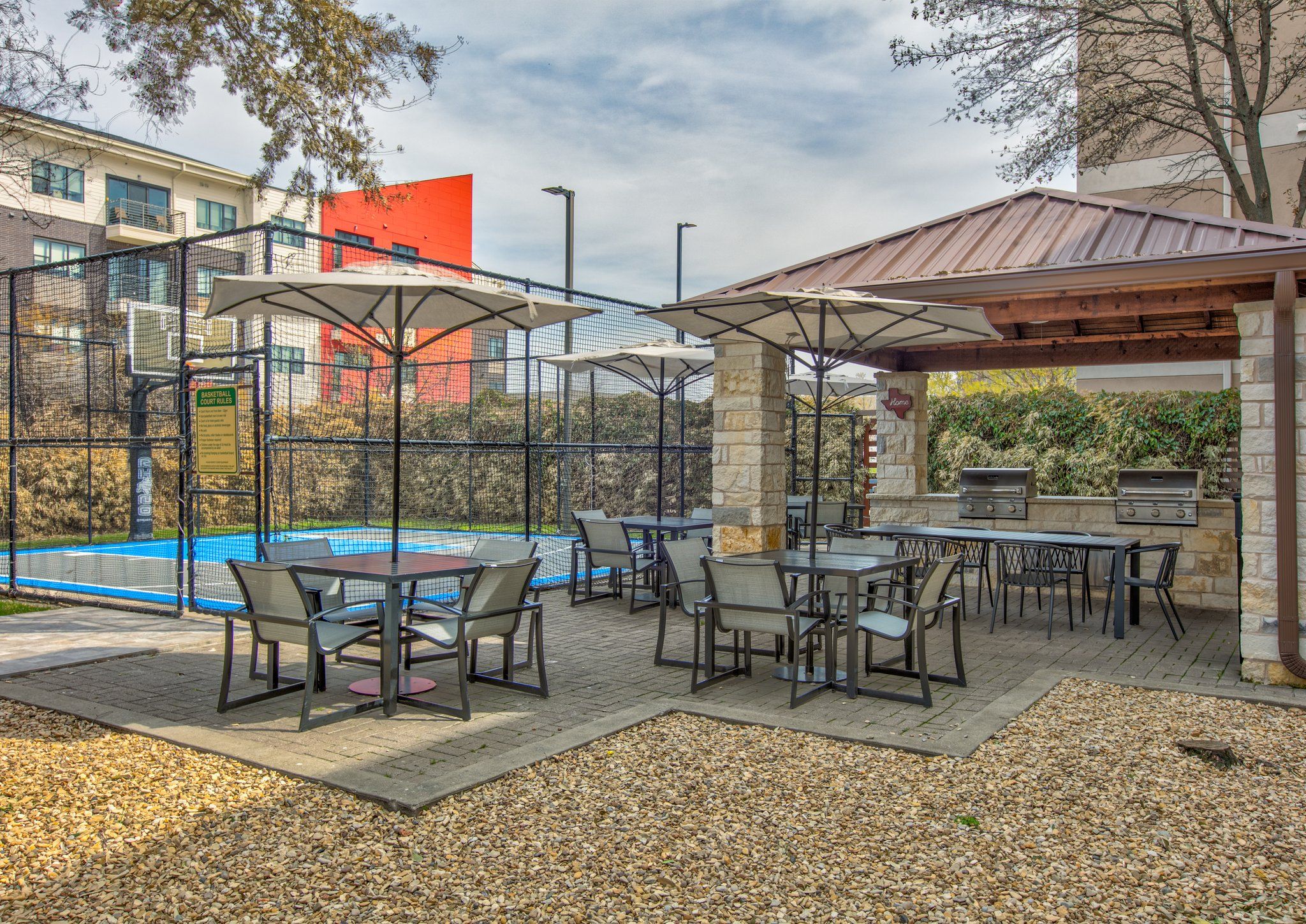 image Patio tables with umbrellas for shaded time outdoors