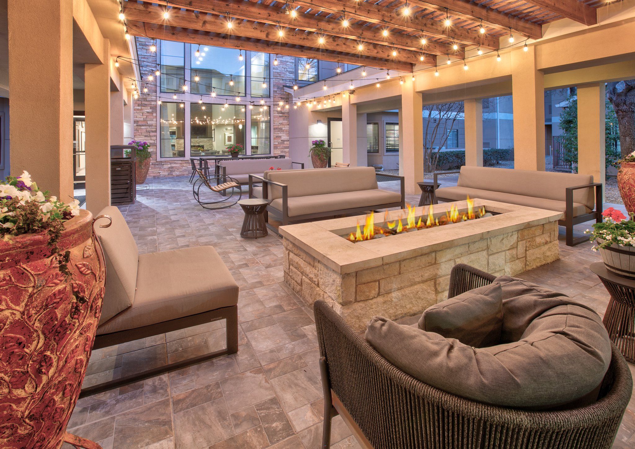 image Unwind in the outdoor lounge around the fire pit