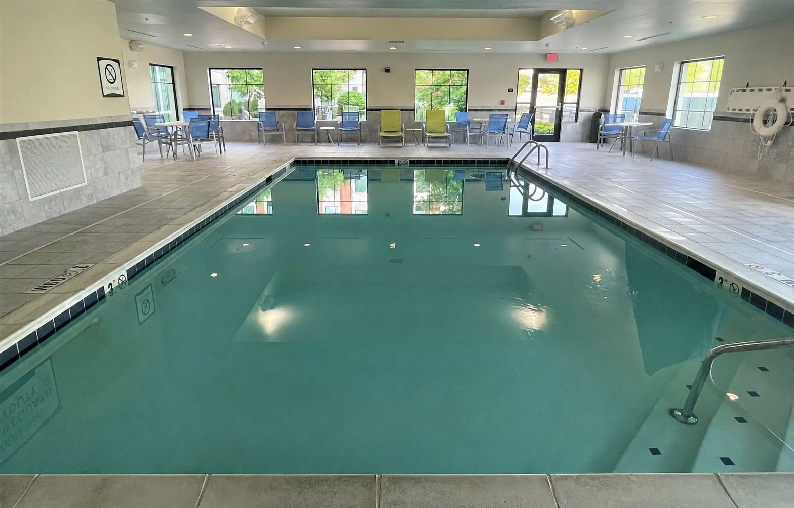 image Dive into relaxation in the indoor pool, surrounded by natural light and comfortable seating.