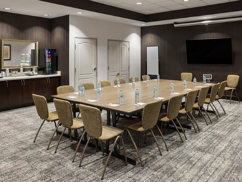 image Brainstorm in a flexible meeting space designed for easy team collaboration.