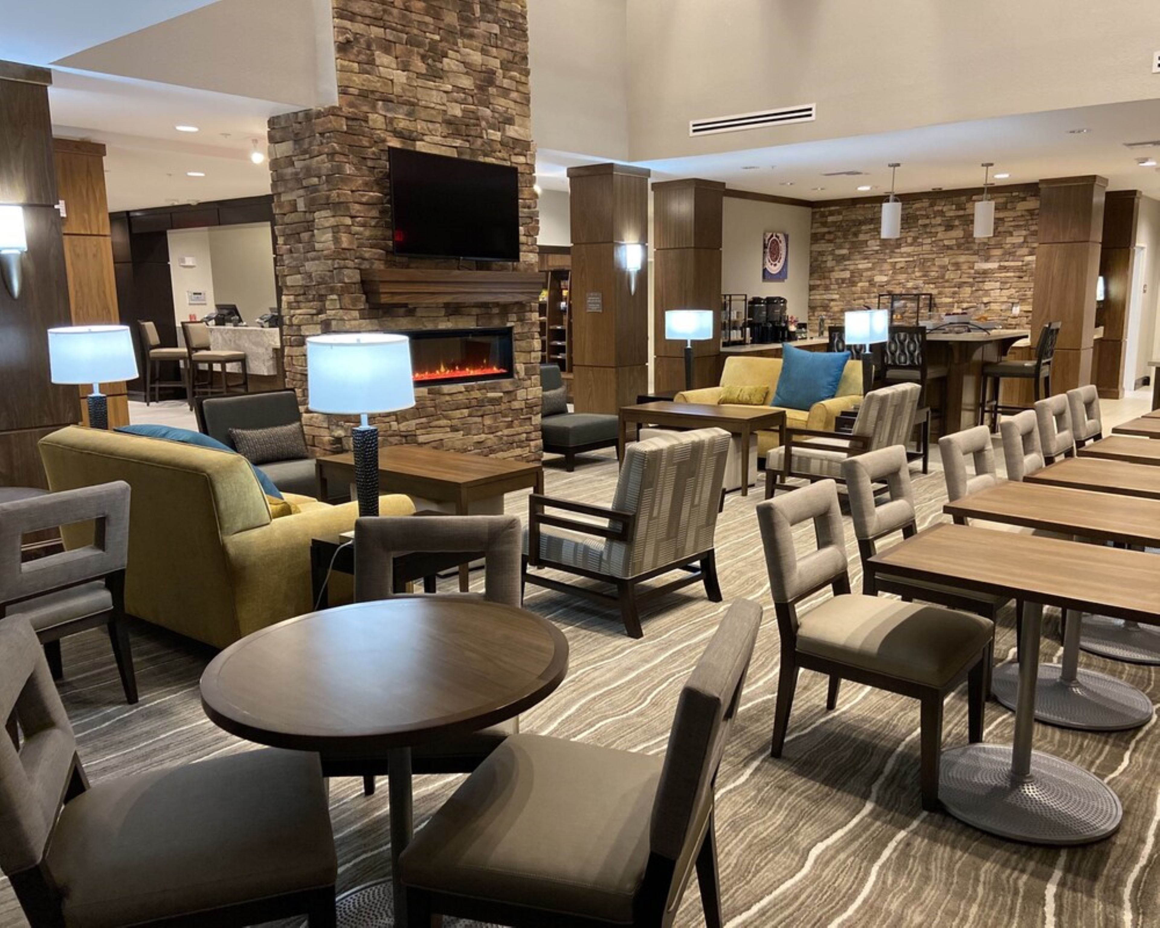 image Comfortable lounge area with modern seating and fireplace.