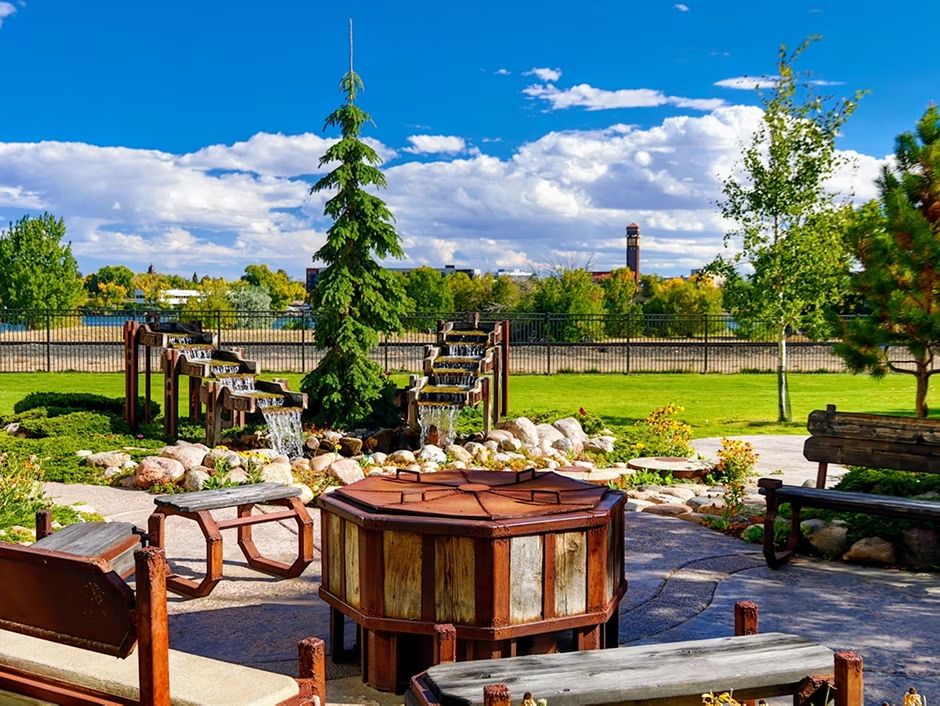 image Relax by the bubbling streams and lush greenery in this serene outdoor space.